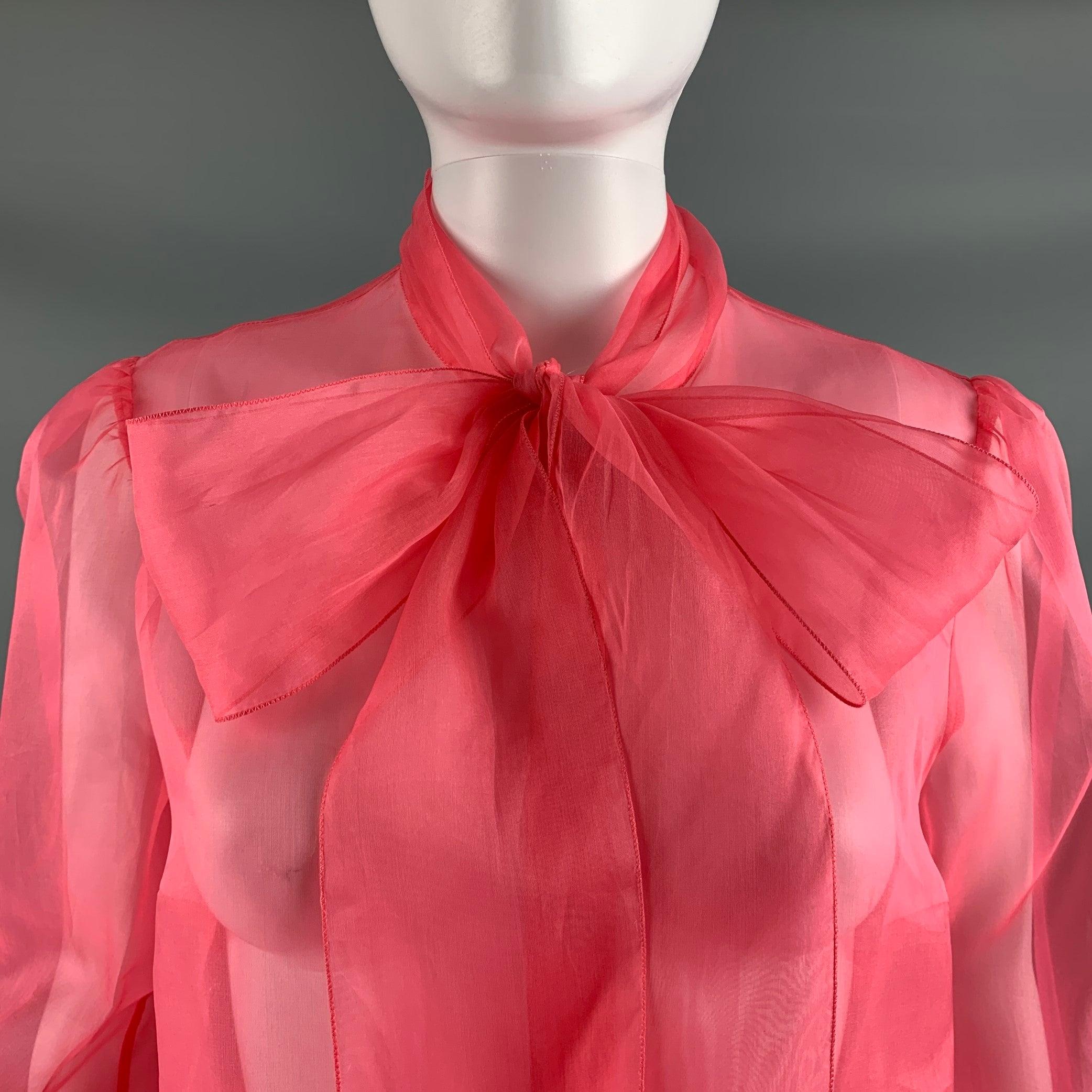 DOLCE & GABBANA long sleeve dress blouse comes in an orange woven material featuring a see through style, elastic hem sleeves, neckline tie, and a button up closure. Made in Italy.Excellent Pre-Owned Condition. Fabric tags removed. 

Marked:   Not