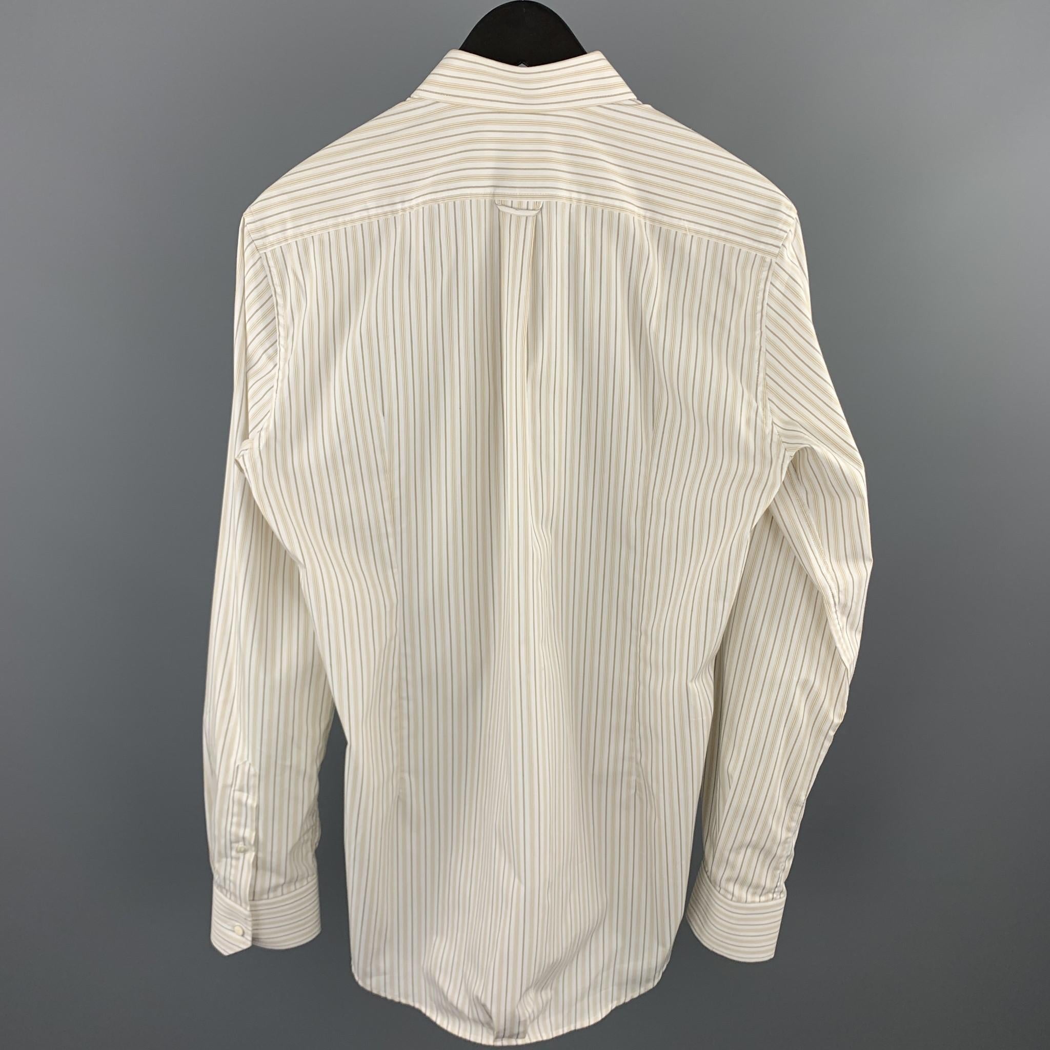 D&G by DOLCE & GABBANA long sleeve shirt comes in a white stripe cotton featuring a button up style and a spread collar. Made in Italy.

Excellent Pre-Owned Condition.
Marked: 15 3/4 - 40

Measurements:

Shoulder: 17 in. 
Chest: 42 in. 
Sleeve: 26.5