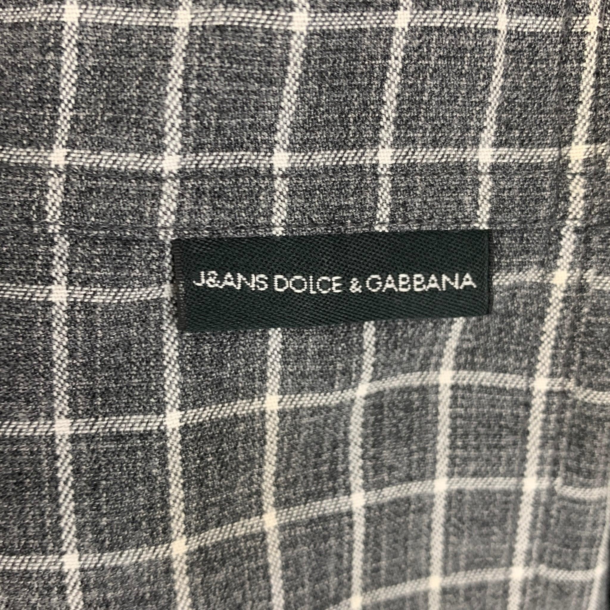 J&ANS by DOLCE & GABBANA button down shirt features a grey and white plaid. Composed of a wool and rayon blend. Made in Italy.
Very Good Pre-Owned Condition. 

Marked:   S
 

Measurements: 
 
Shoulder: 18 inches Chest: 42 inches Sleeve: 24 inches