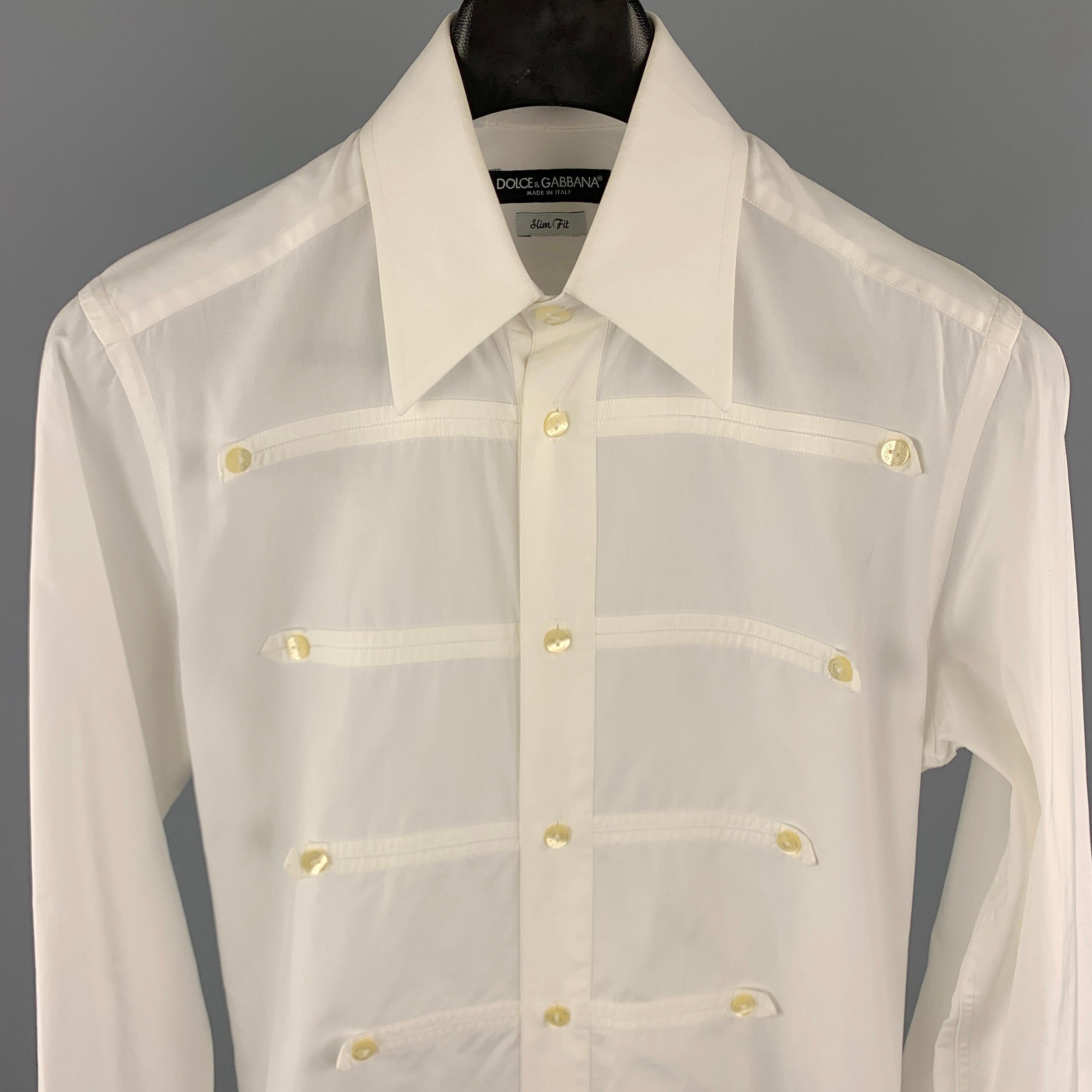 DOLCE & GABBANA Long Sleeve Shirt comes in a white tone in a solid cotton material, with a pointed collar, button details at front, pleat at back, buttoned cuffs, button up.  Minor wear. Made in Italy.

Very Good Pre-Owned Condition.
Marked: 15 /