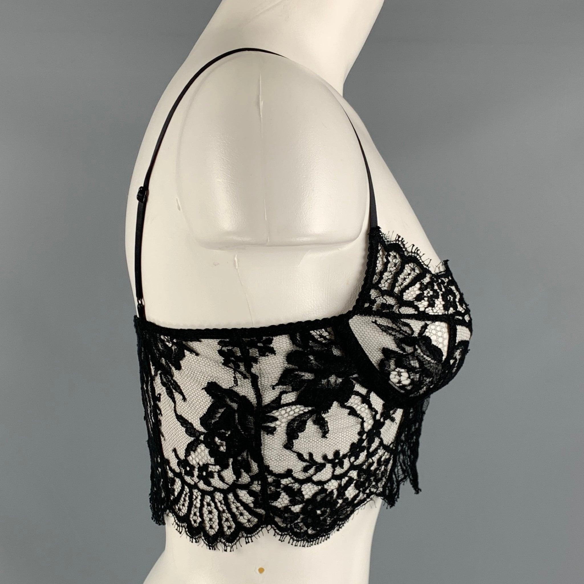 DOLCE & GABBANA bralette casual top comes in a black lace cotton featuring a hook & eye closure. Made in Italy.Excellent Pre-Owned Condition. 

Marked:   38 

Measurements: 
  Bust: 29 inches Length: 5 inches  
  
  
 
Reference: 127338
Category: