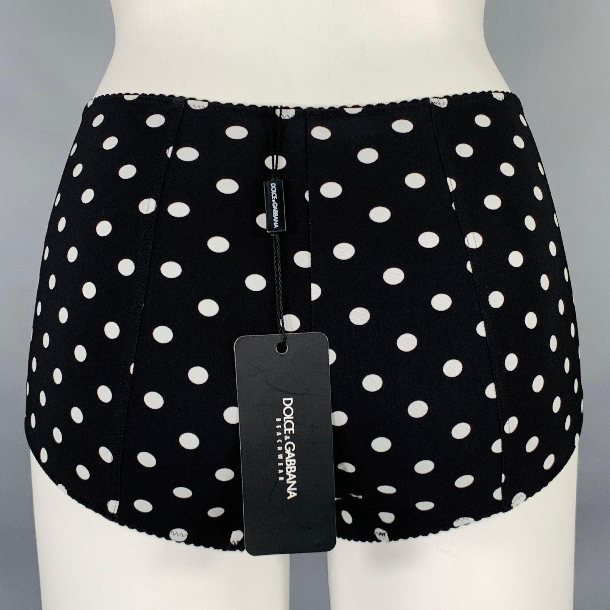 DOLCE & GABBANA Beachwear swim bottom
in a black and white polyamide stretch blend fabric featuring a polka dot pattern. Made in Italy.New with Tags. 

Marked:   XS 

Measurements: 
  Waist: 20.5 inches Rise: 6.5 inches 
  
  
 
Sui Generis
