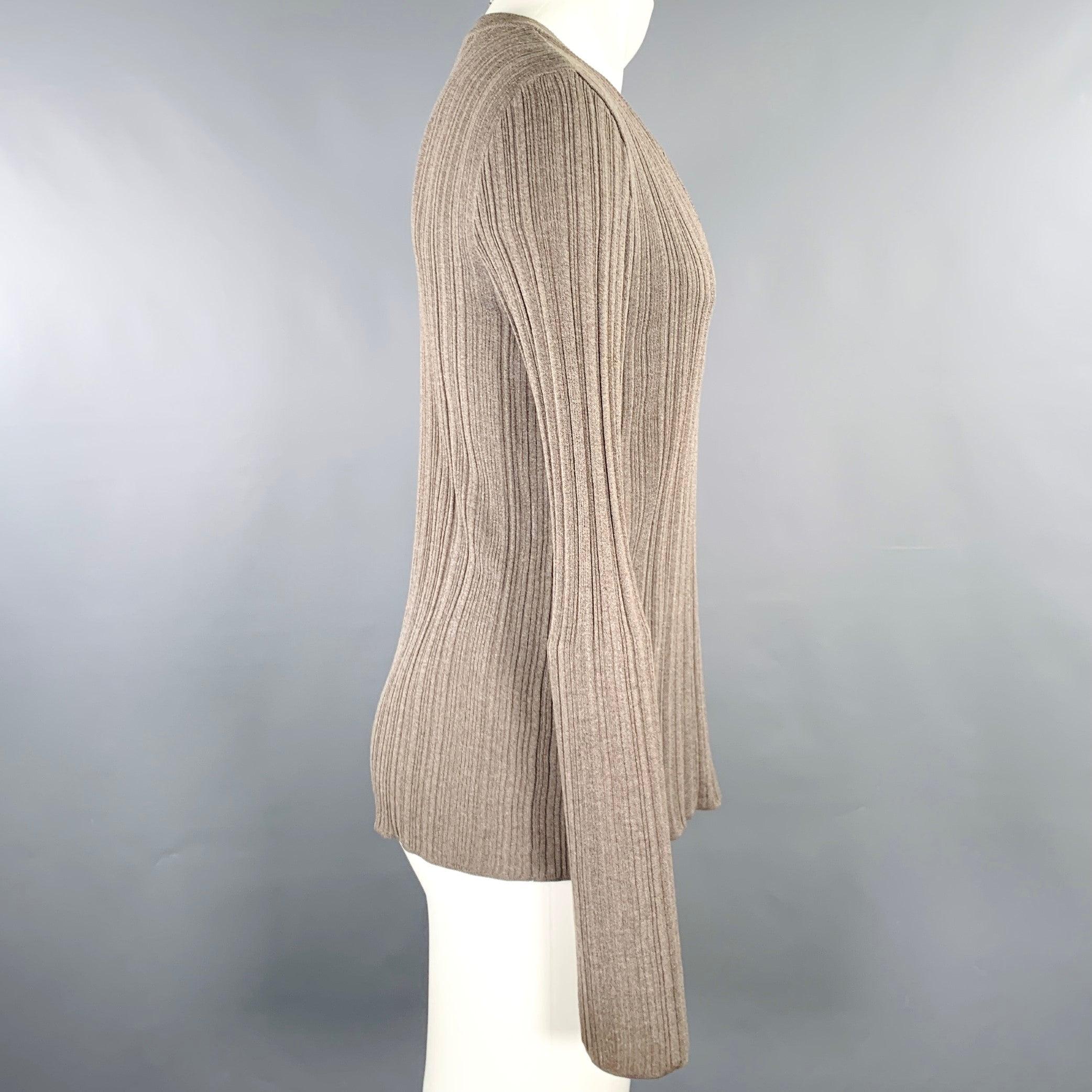 DOLCE & GABBANA pullover
in grey taupe fabric knit featuring a rib knit style, long sleeves, and deep V-neck. Made in Italy.Excellent Pre-Owned Condition. 

Marked:   IT 46 

Measurements: 
 
Shoulder: 16.5 inches Chest: 38 inches Sleeve: 28 inches