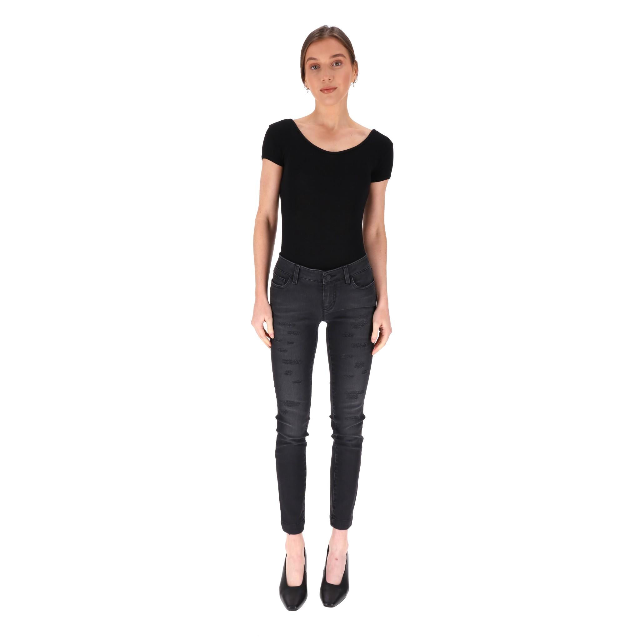 Dolce & Gabbana Skinny Jeans

Black washed skinny jeans featuring a distressed look.

Complemented by branded black buttons, a concealed zip fly with the iconic D&G signature, and a leather trim at the back.

Size - 38IT

Condition - Good (Small