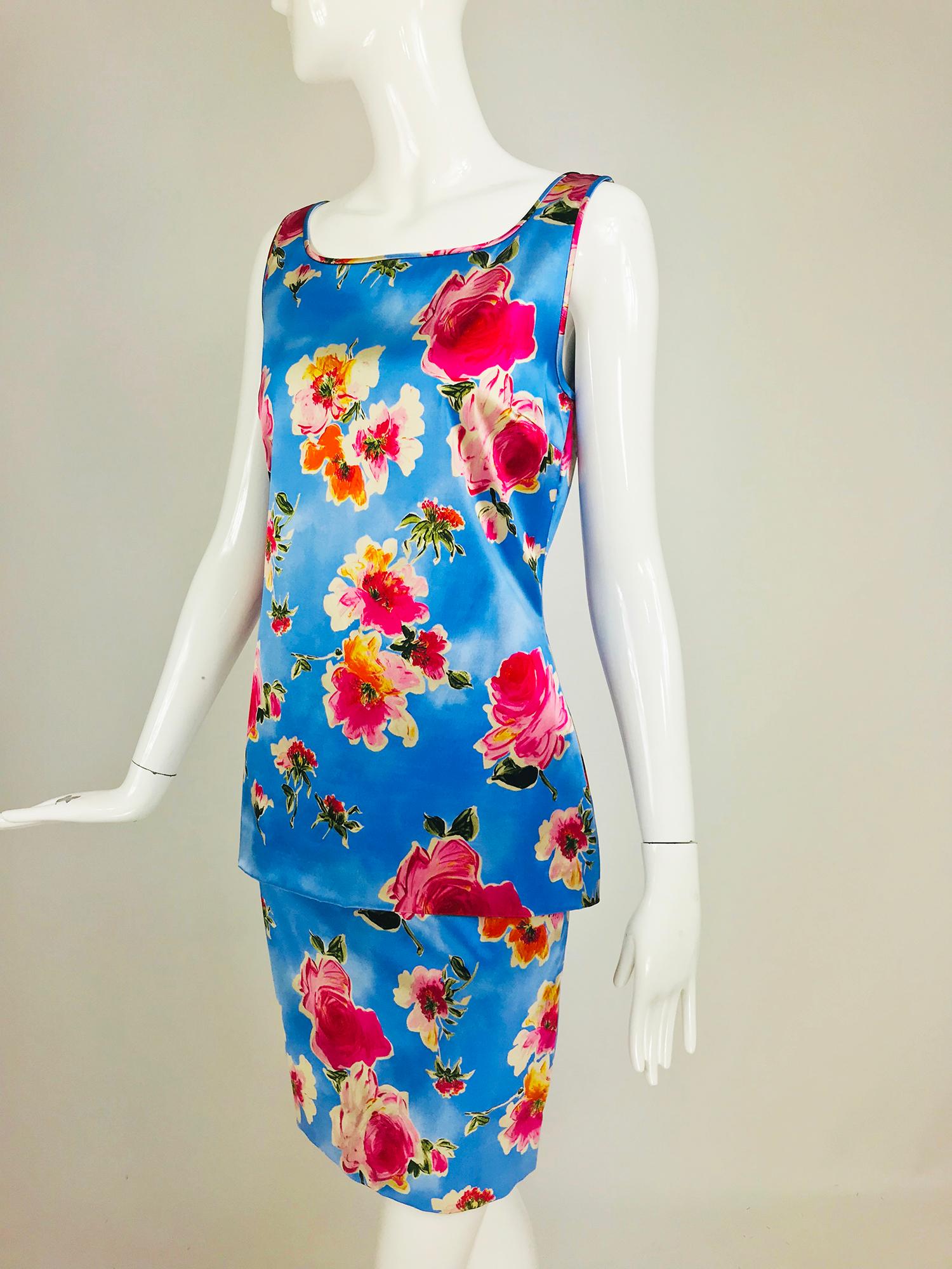 Dolce & Gabbana sky blue photo floral print silk skirt set. Two piece set features a long sleeveless fitted tank top, which closes at the back with a long hidden row of hooks and eyes, scoop neckline front and back. The matching skirt is fitted,