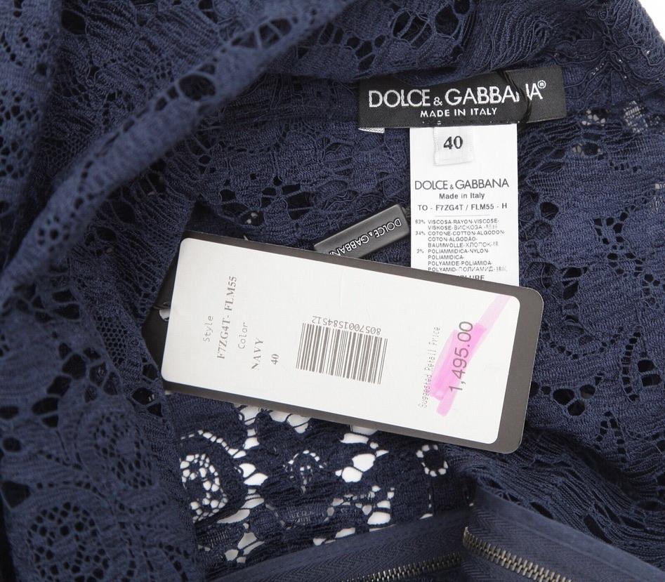 GUARANTEED AUTHENTIC DOLCE & GABBANA NAVY SLEEVELESS LACE BLOUSE

Retailed excluding sales taxes, $1,495


Design:
- Sleeveless navy blue lace blouse.
- Black trim at neck and armhole.
- Attached slip underlay.
- Full rear zipper closure on both