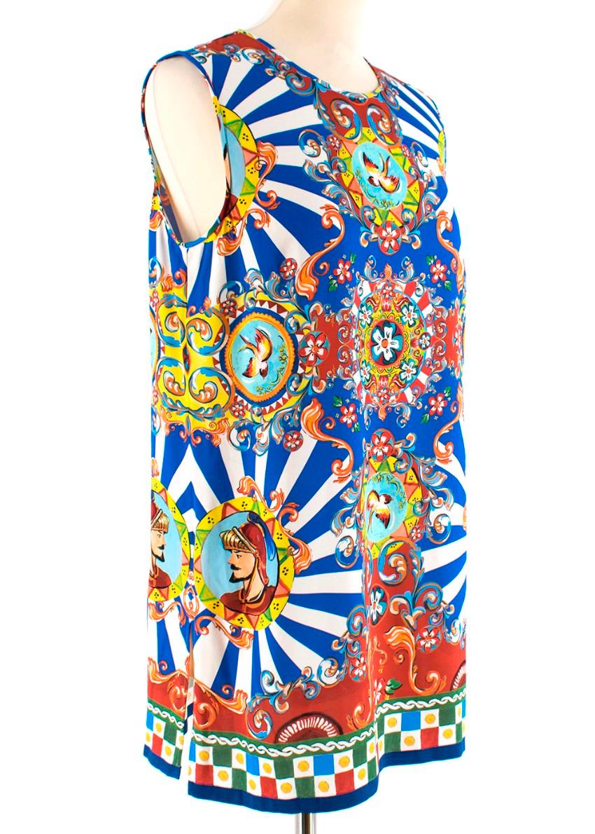 Dolce & Gabbana Sleeveless Patterned Top

- Long top or Mini Dress
- Small split down either size 
- Round neck
- Mini snap button on the back of the neck line
- Patterned hem
- Small bird pattern all over 
- All tags have been