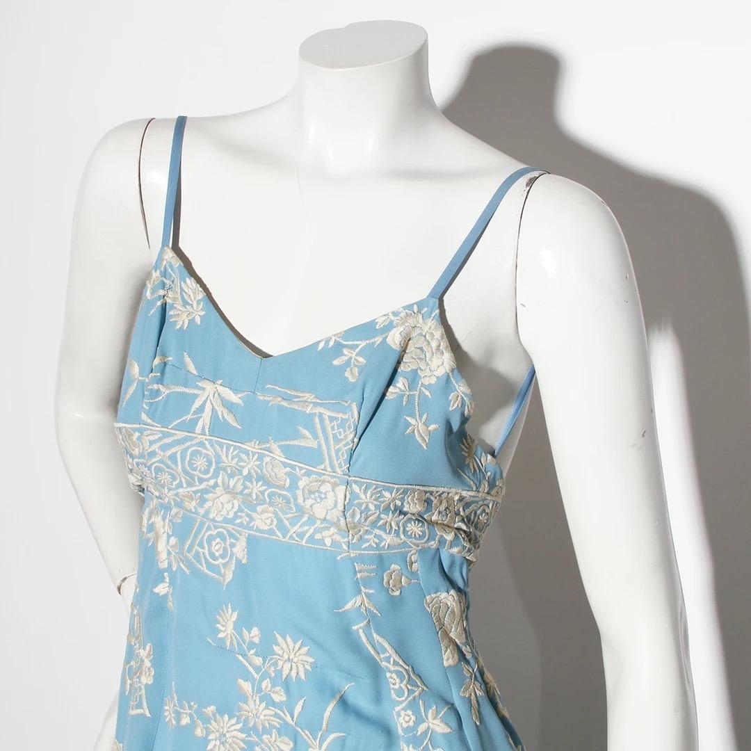 Dolce & Gabbana Slip Dress
Spring / Summer 1997 
Made in Italy 
Baby blue 
White floral embroidery throughout dress 
Thin tank straps 
Empire waist 
Empire waist has a strap with three hook and eye closure for fit 
Interior of bust is lined in nude