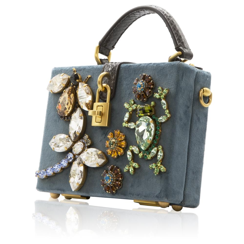 Crafted in Italy from Aegean blue velvet, this whimsical box bag from the Dolce & Gabbana Fall/Winter 2014 Runway Collection was modelled on the designers' idea of the Mediterranean woman - strong, feminine, exuberant. Finished with gold-toned metal