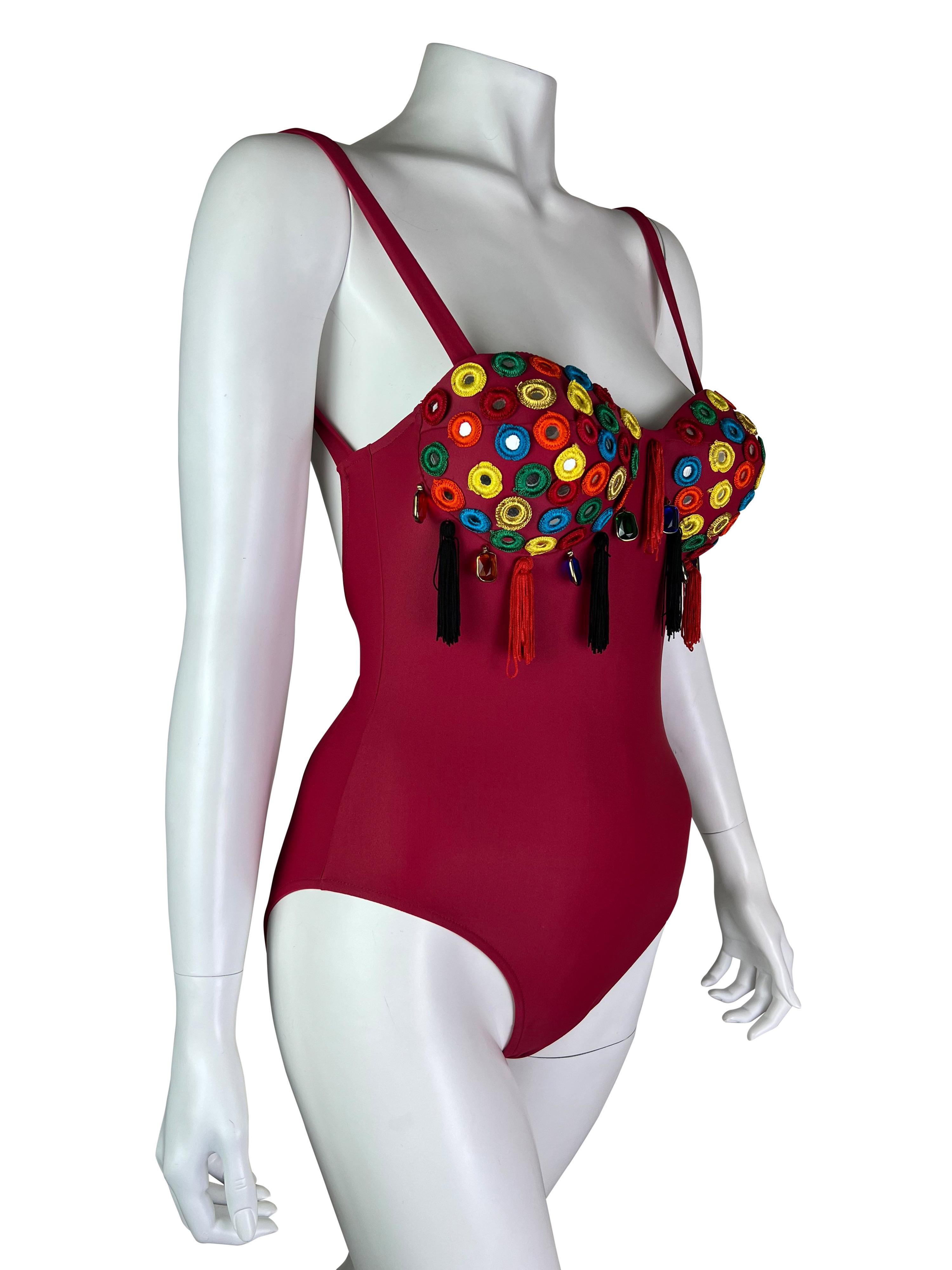 A stunning never worn swimsuit with beautiful embellishments from the iconic Dolce & Gabbana collection. 

Size IT 42, would fit sizes S and M, cups are padded and would fit sizes 34B, 34C, 36B the best.

Measurements (flat lay on one side, fabric