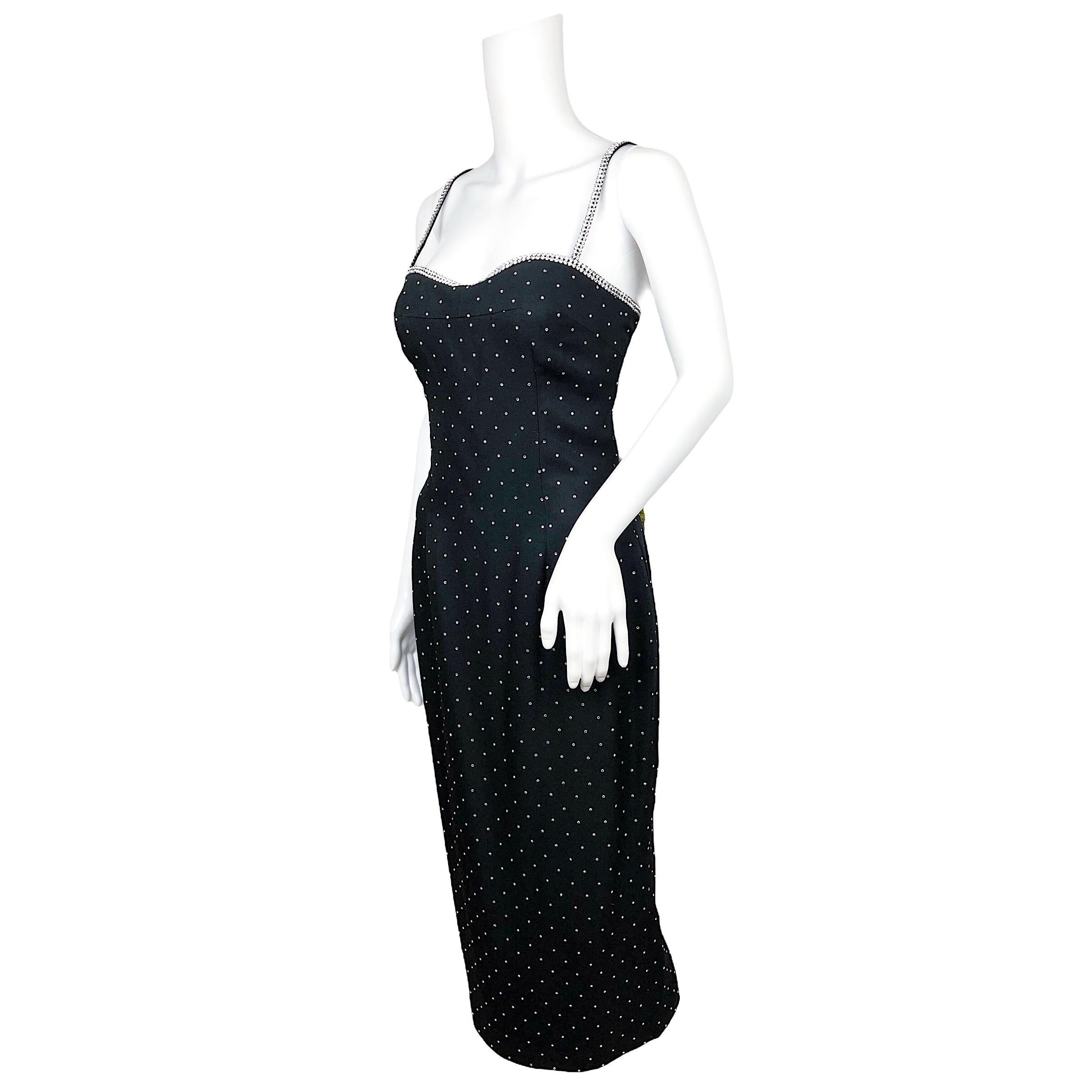 Dolce & Gabbana Spring Summer 1995 black body con dress embellished with crystals on straps and cleavage. Strass allover the body.  The dress was seen on the runway on Nadja Auermann. 
Size is Italian 42 on tag, fits more like an Italian 40/ US 4/