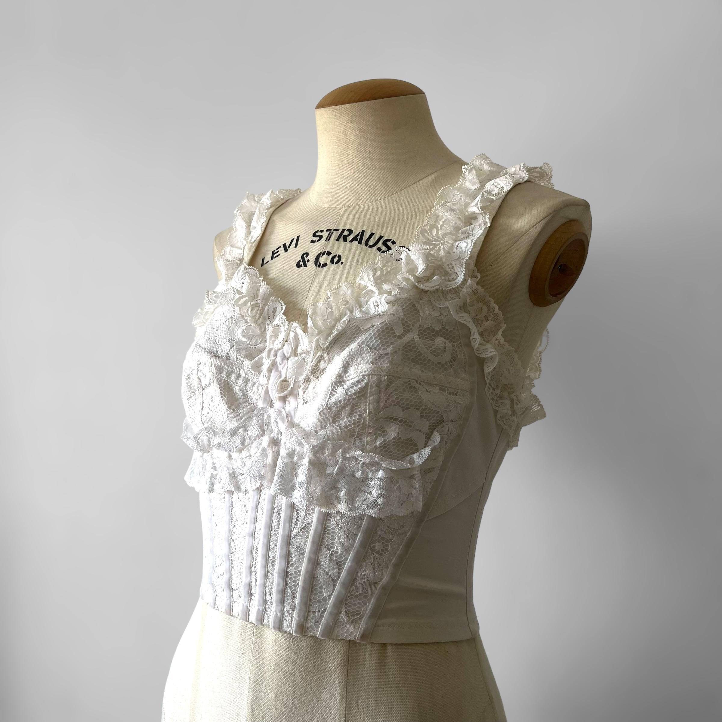 **Dolce & Gabbana Spring Summer 1993 Collection**

Introducing a stunning piece from Dolce & Gabbana's Spring Summer 1993 collection by Domenico Dolce and Stefano Gabbana. This vintage corset, tagged as size L (44IT), runs small and fits better on