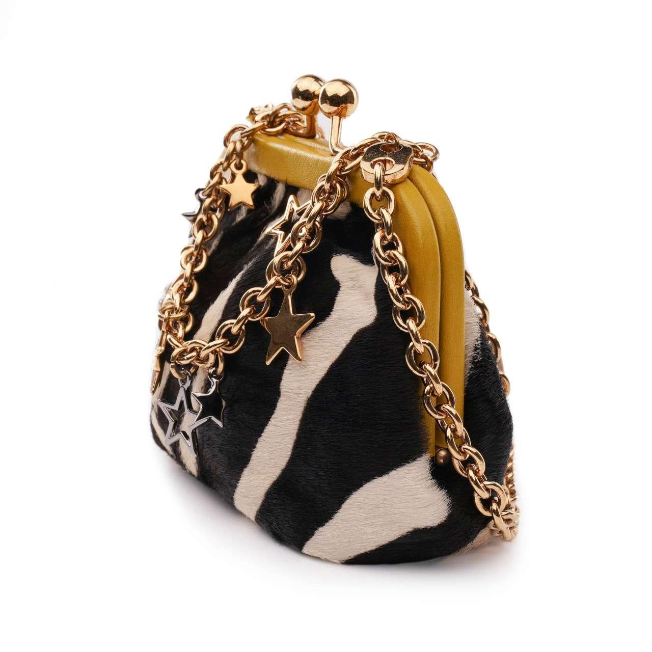 - Lambskin and calfskin fur purse bag with metal stars crystal chain strap in black, white, yellow and gold by DOLCE & GABBANA - New with Tag, Dustbag, Authenticity Card - Material: 80% Calfskin fur,  20% Lambskin - Lining: Fabric - Interior: