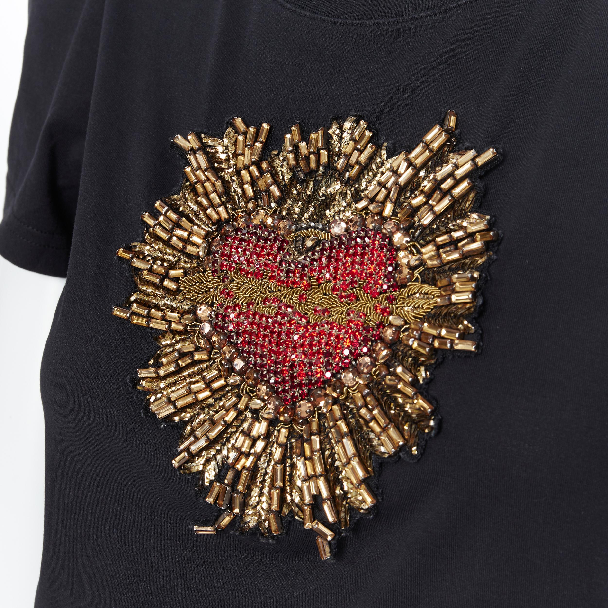 DOLCE GABBANA strass crystal bead embellished heart puff sleeve t-shirt IT40
Brand: Dolce Gabanna
Model Name / Style: T-shirt
Material: Cotton
Color: Black
Pattern: Solid
Extra Detail: Intricate gold and crystal beaded heart.
Made in: