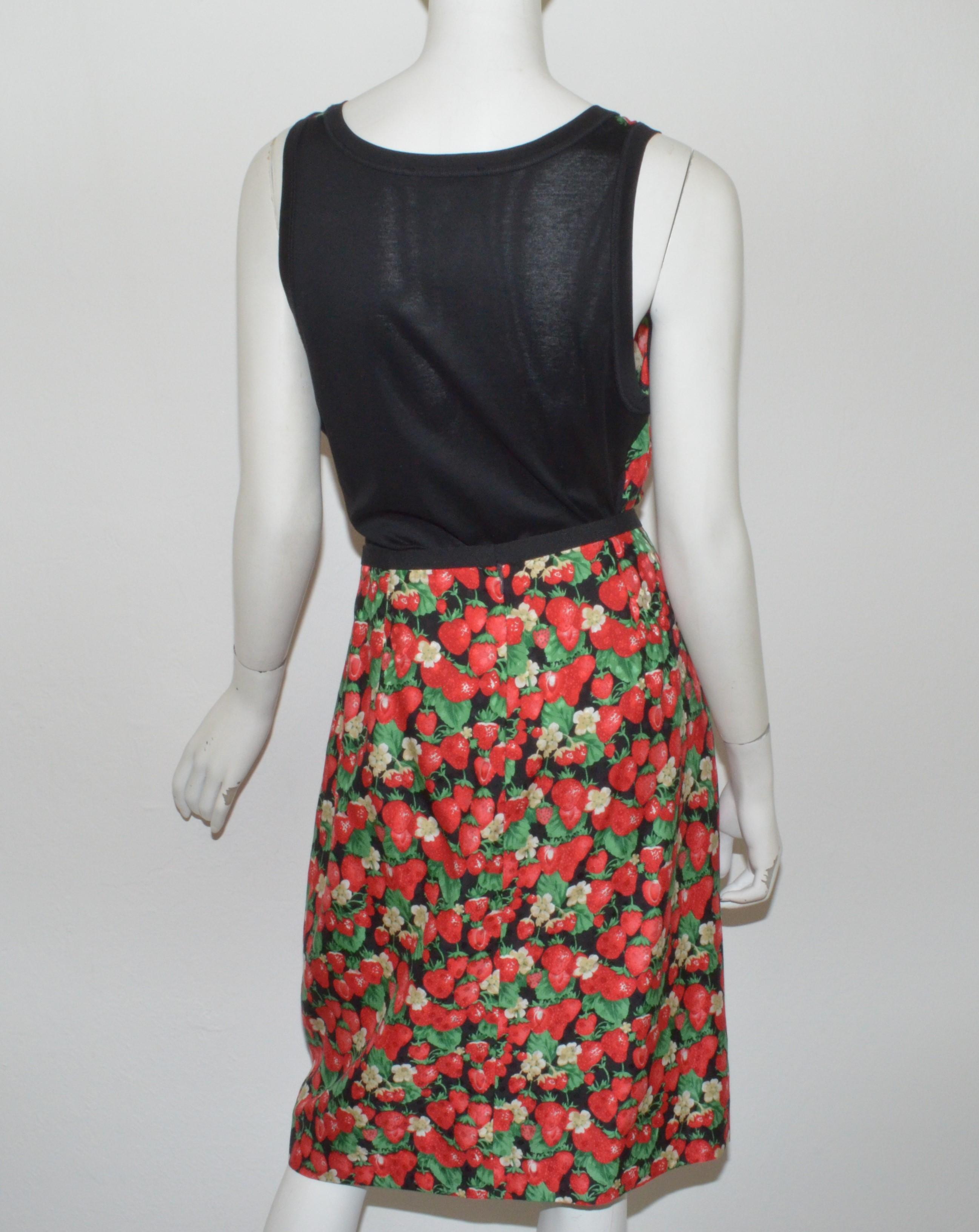 Dolce & Gabbana strawberry print skirt and top set — Top has a v-neckline with functional buttons, size 48. Skirt has a back zipper closure and a faille ribbon trim around the waistline, size 46, 100% silk, made in Italy.

Measurements:
Top - bust