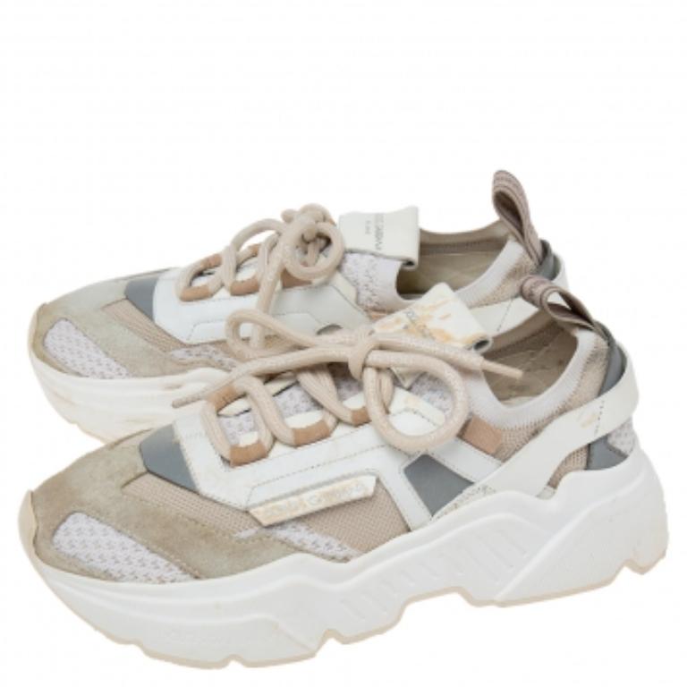 An everyday pair you're going to love is this one by Dolce & Gabbana. These designer sneakers for women are sewn in a mix of materials, secured with laces, added with pull tabs, and mounted on well-constructed rubber soles.