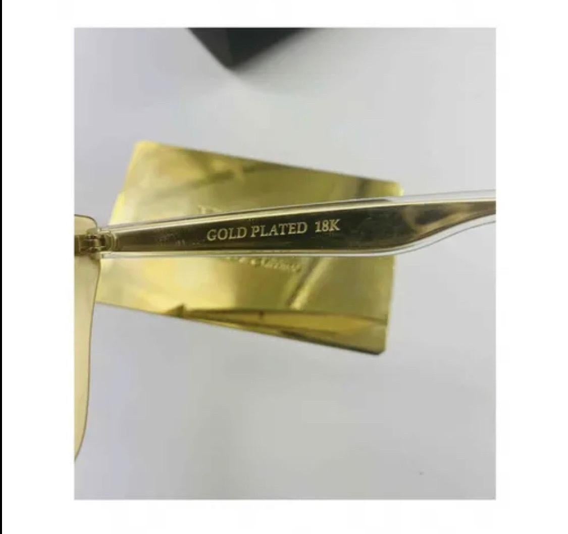 Occhiali da sole Dolce & Gabbana con
lenti sfumate placcate oro
con custodia, dustbag e scatola originale!
