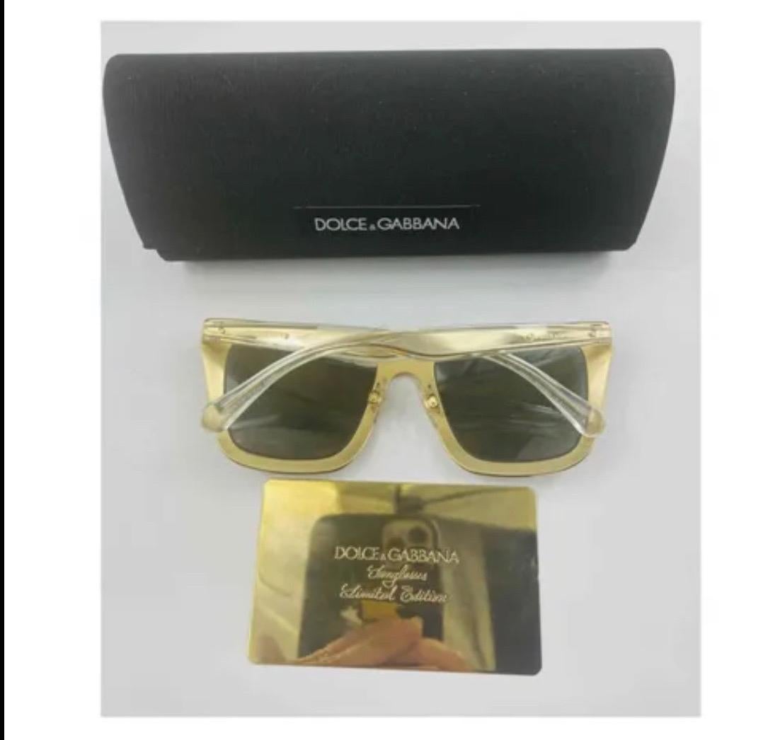 Gray Dolce & Gabbana Sunglasses with
gold-plated gradient lenses For Sale