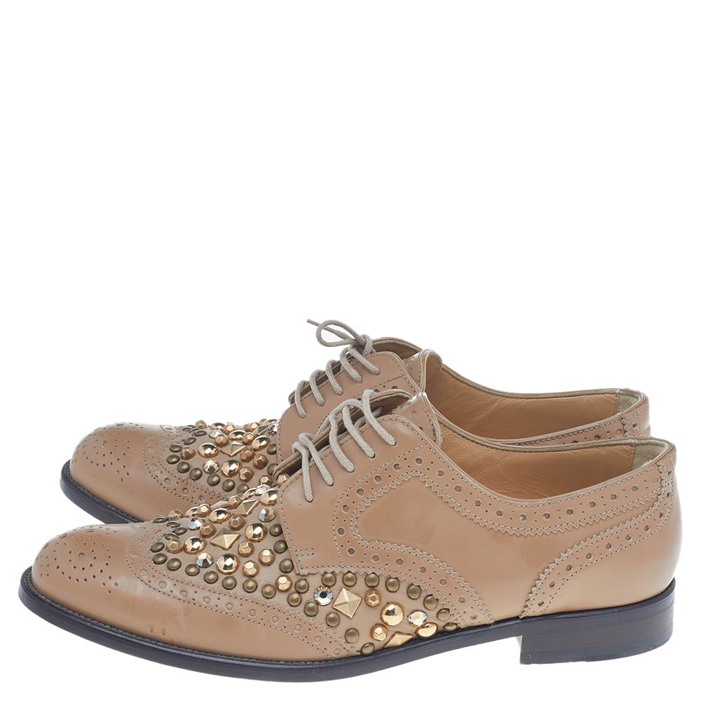 These Derby shoes from Dolce & Gabbana are beautiful in every way. These shoes are crafted using tan Brogue leather with studs accents and lace-up details accentuating the upper. Let your feet experience style and panache as you put on these Derby
