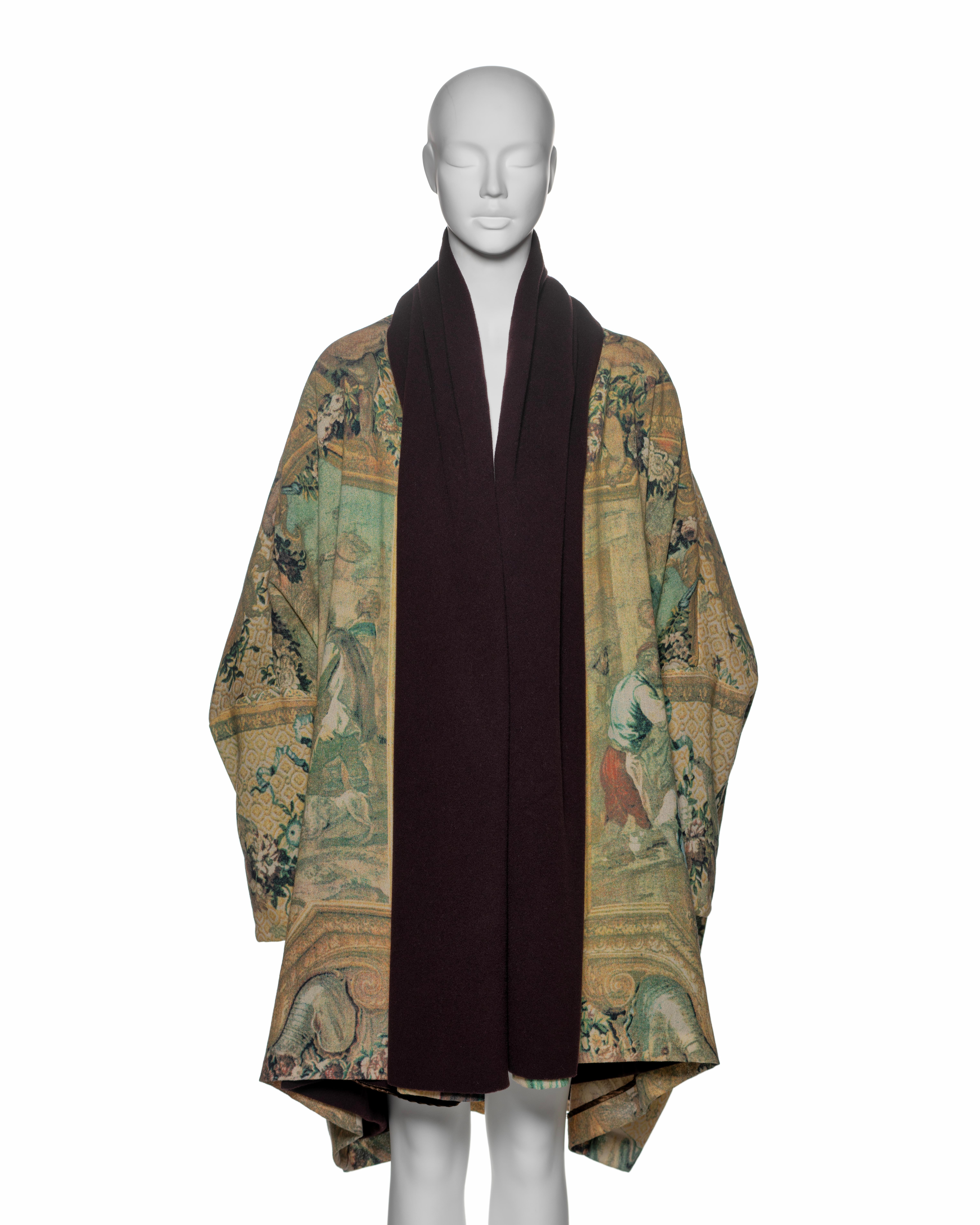 This rare Dolce & Gabbana coat from the Fall-Winter 1993 collection is crafted in a loose, cocoon-like silhouette with exaggerated sleeves and draped volume. It features a tapestry-inspired print, likely drawing from 18th-century European rococo art