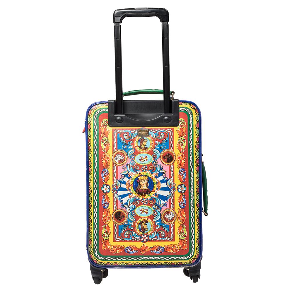 Dolce & Gabbana's aesthetic of vibrant colors, incredible patterns, and timeless charm is perfectly presented by this luggage case. The leather creation is covered in Teatro Dei Pupi prints to create that 'instantly-recognizable Dolce & Gabbana'