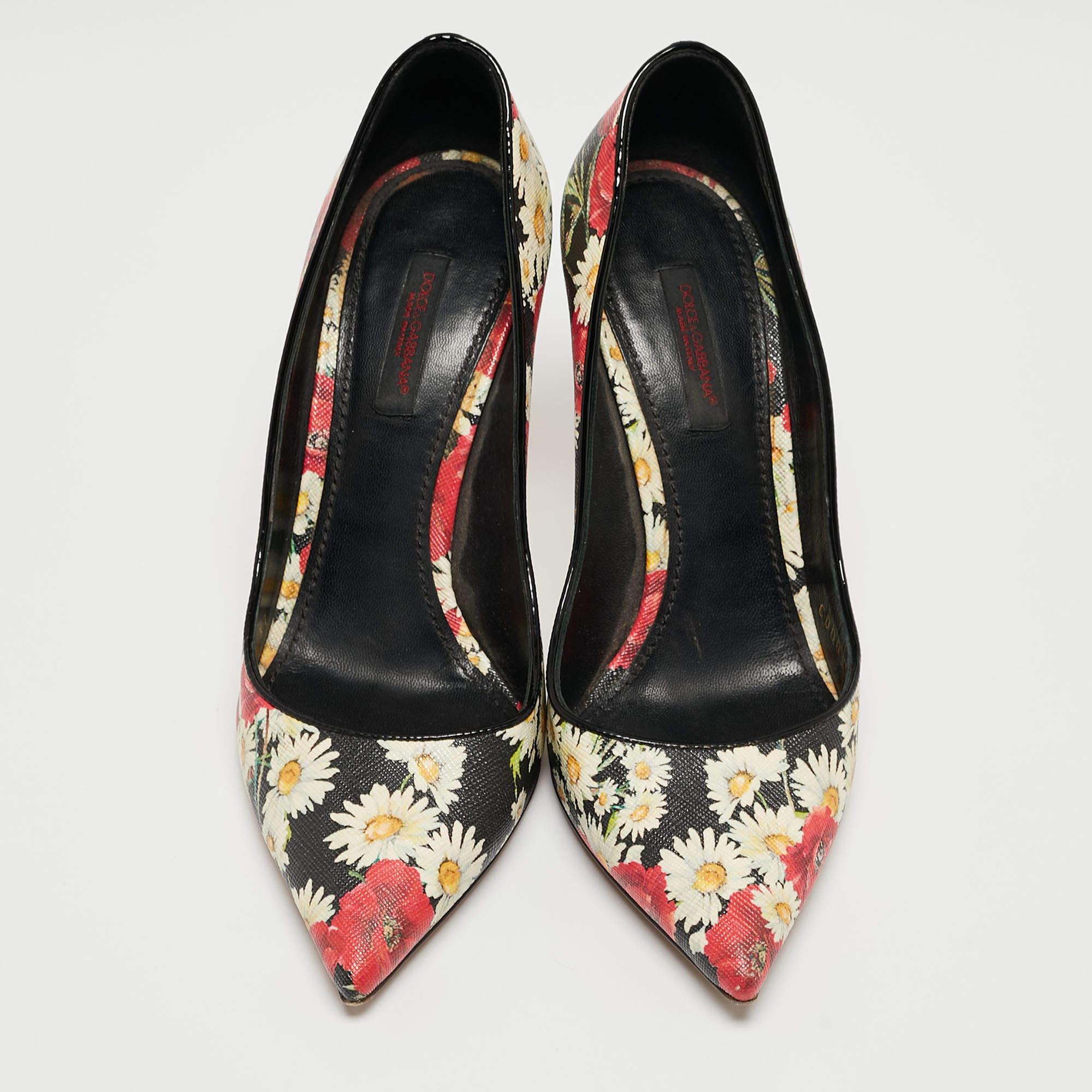 Dolce & Gabbana's collections are a testament to the label's opulent and glamorous aesthetics. These pumps are crafted from leather and are detailed with floral prints all over. They are finished off with tall slender heels and pointed toes.

