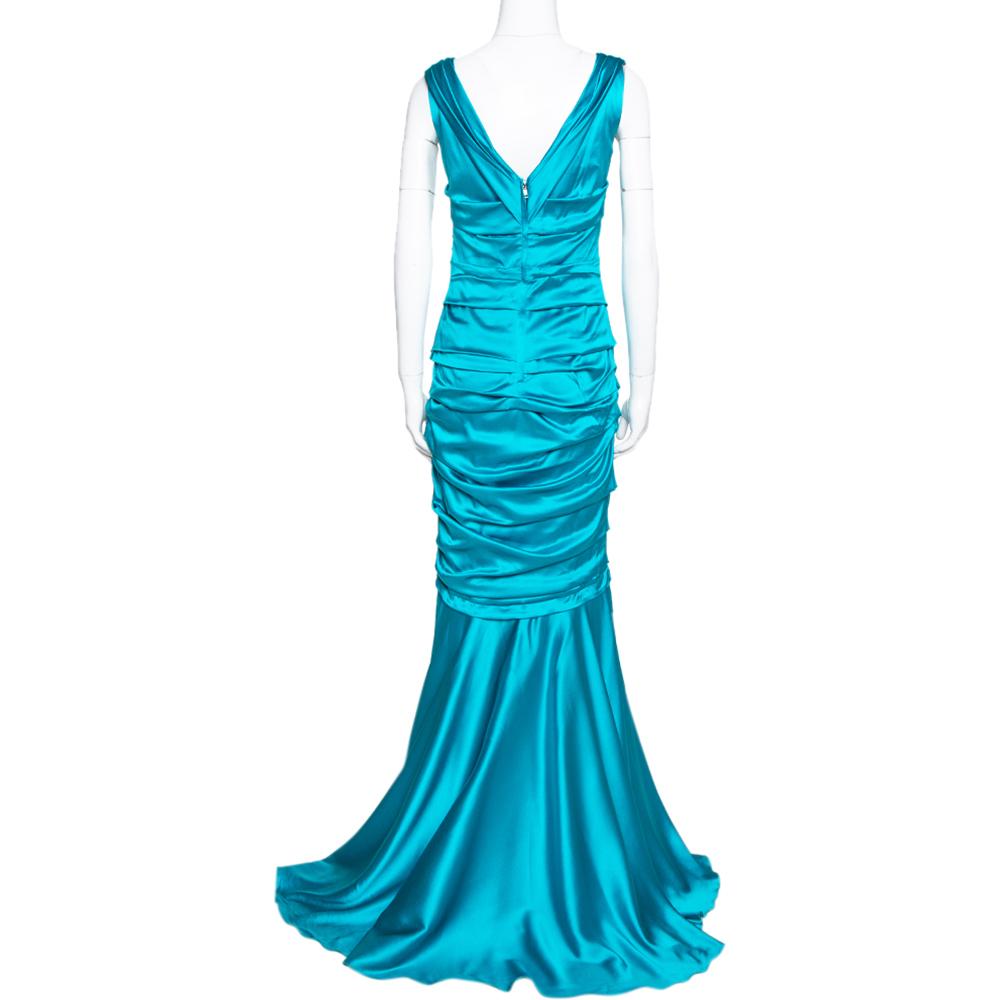 Designed in a gorgeous turquoise blue shade, this maxi dress from Dolce & Gabbana is love at first sight! The silk satin creation features a ruched flattering silhouette and a square neckline. The floor-length dress flaunts a deep V-back with a zip
