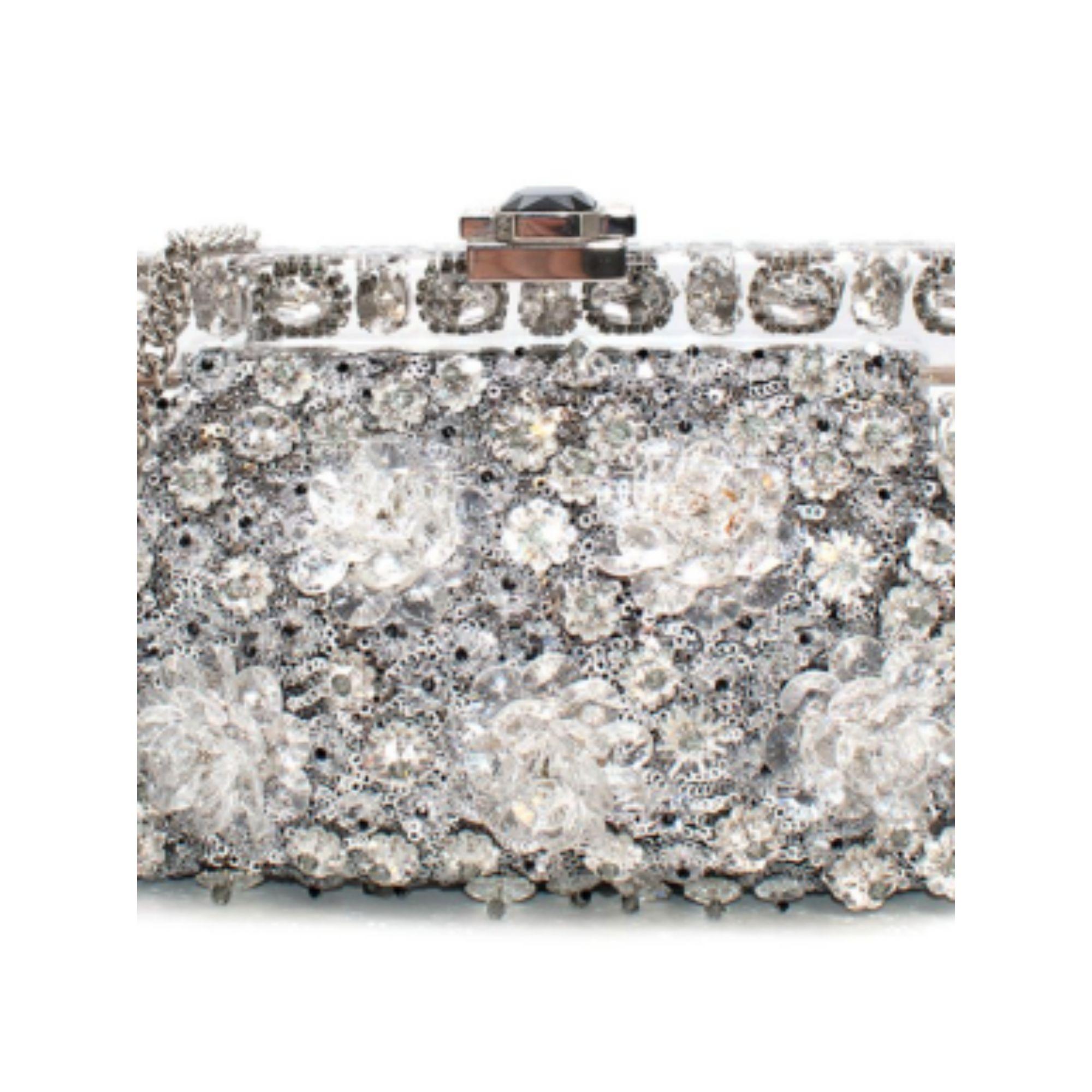 Dolce & Gabbana Vanda small embellished clutch

- Magnetic clasp fastening
- Thin shoulder chain
- Sequinned body with crystal flower detailing
- One main compartment with slip pocket
- Satin lining

Material
PVC and satin

Made in Italy

PLEASE