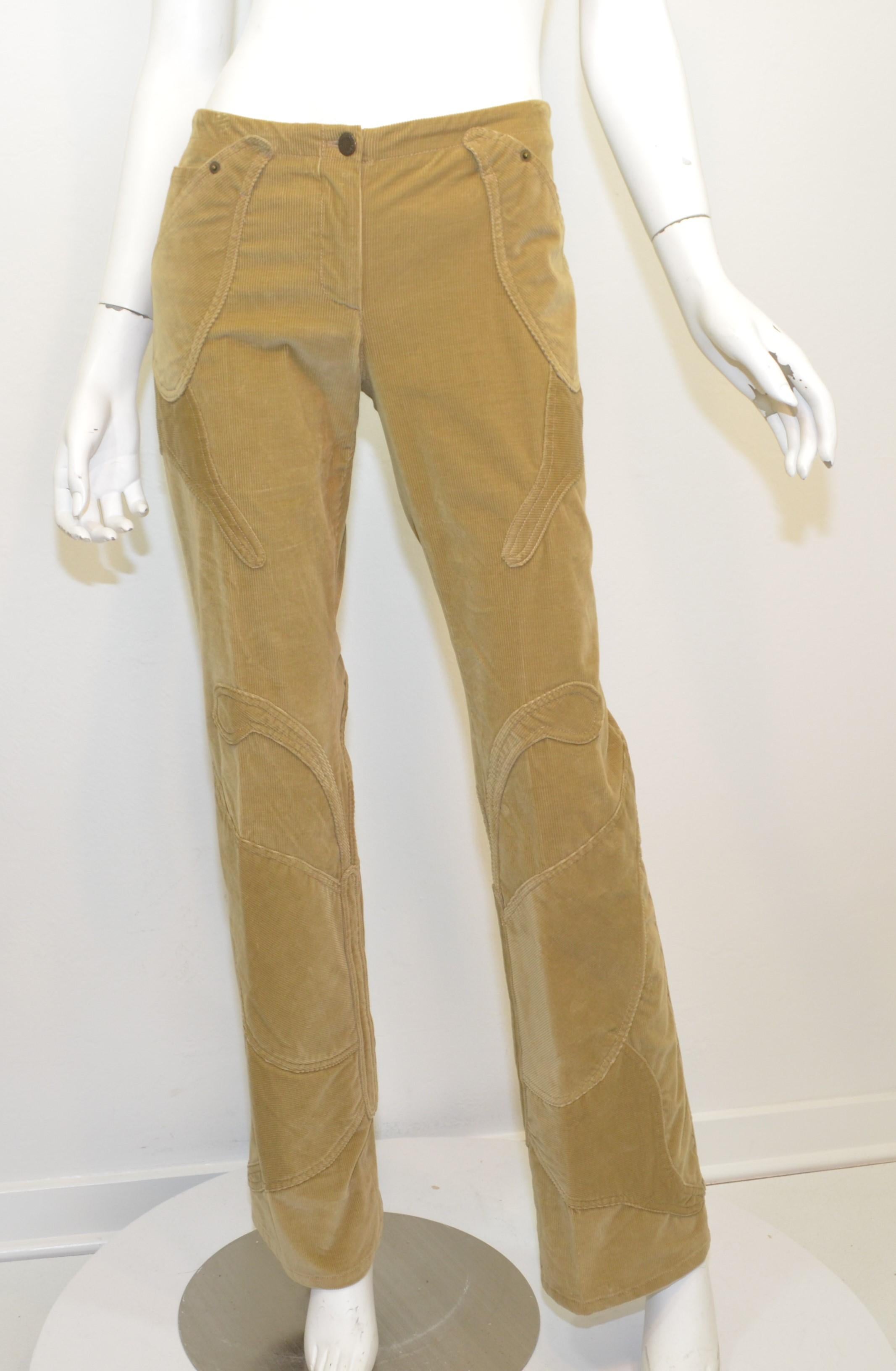 Dolce & Gabbana Velvet Corduroy Pants featured in a camel/tan color with a butterfly design along the pant legs and functional front pockets. Pants have a zipper and button fastening. Labeled size 42, made in Italy 

Measurements:
Waist 32”
Hips