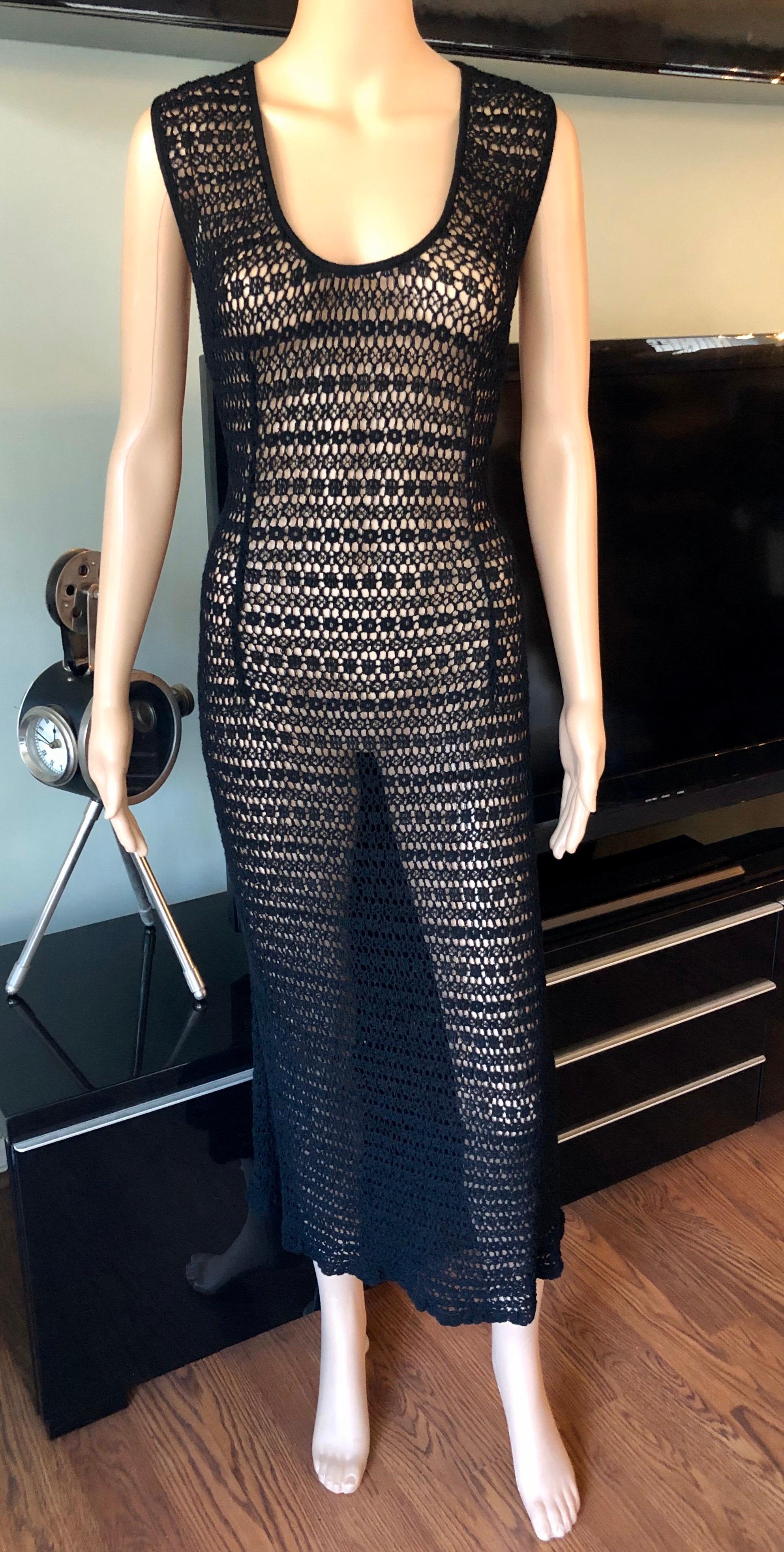 Dolce & Gabbana Vintage 1990's Sheer Open Knit Crochet Fishnet Black Maxi Dress M/L

Dolce & Gabbana vintage dress featuring bateau neckline and open knit throughout. The size tag has been removed. The knit is very stretchy and will fit sizes M-L.