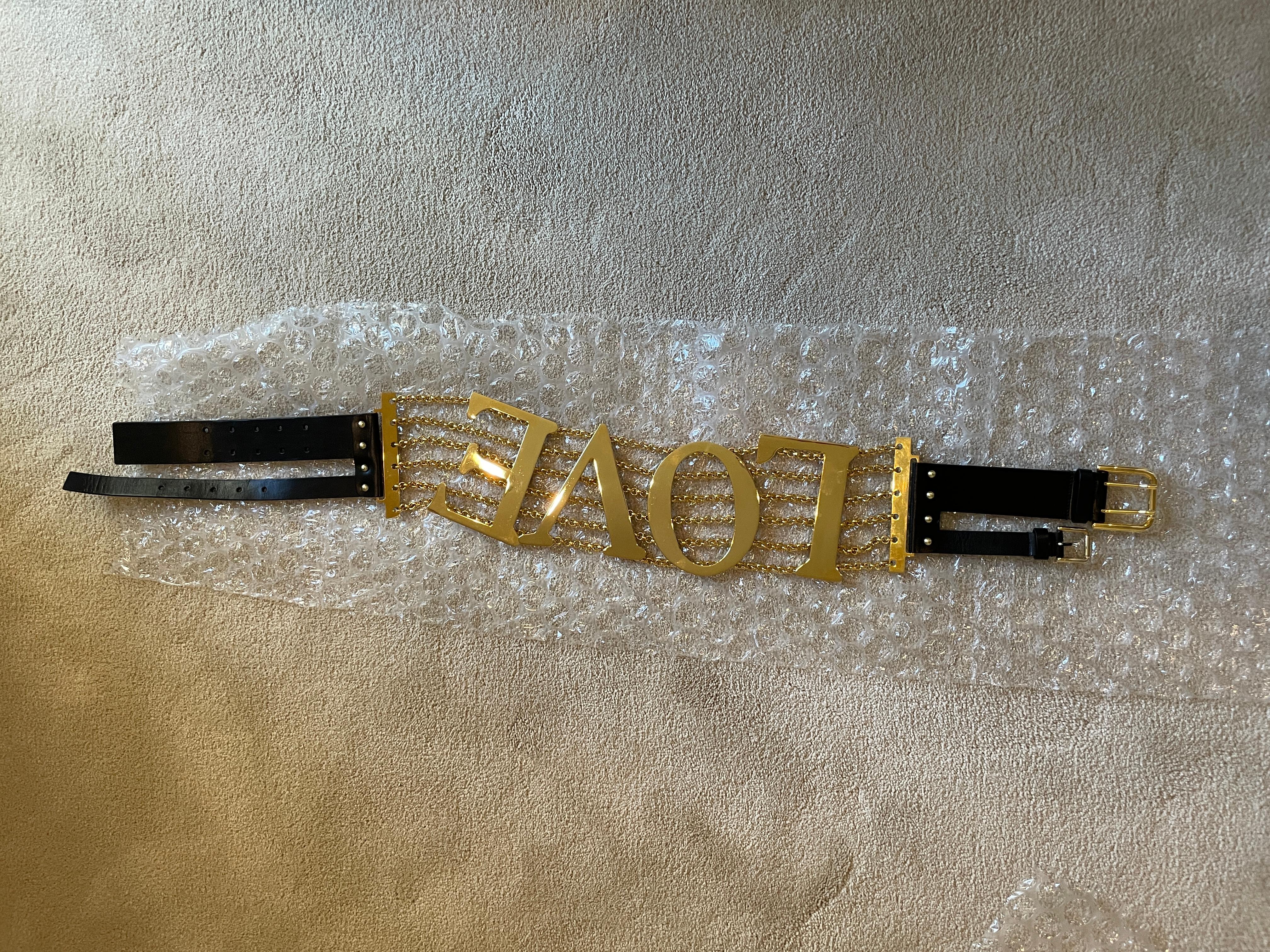 Vintage SS03 Dolce and Gabbana 6 strand LOVE belt, gold metal and black leather. 2 buckles in the back. Totally adjustable, and the letters are movable! See my other listing for the same belt with the letters 