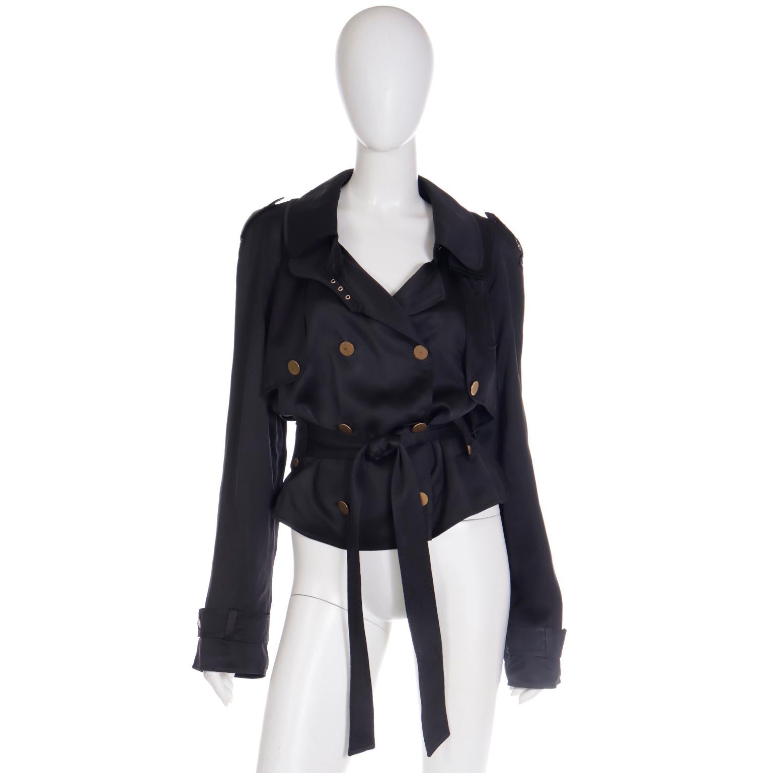 This vintage Dolce & Gabbana jacket is the perfect cropped trench! This double breasted jacket has all of the signature hallmarks of a trench coat like epaulettes, storm flaps, button tabs and a waist belt. We love the look of the jacket in such a