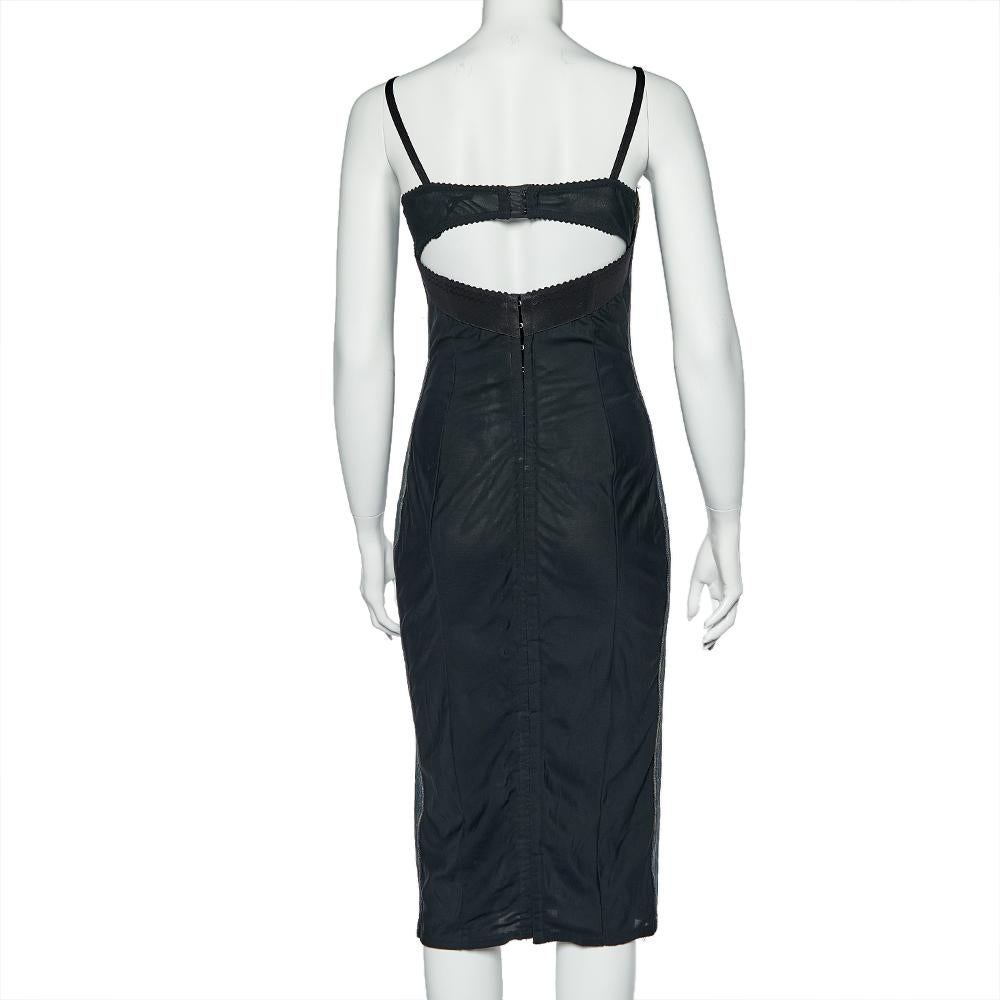 From one of the most loved brands in the fashion industry comes this Dolce & Gabbana dress, which is a classic piece to own. This vintage corset dress is crafted from blue-hued denim, has straps, a fitted silhouette and hook closures.

