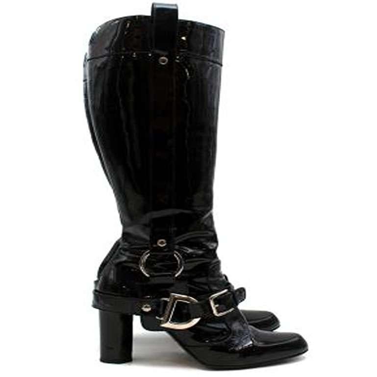 Dolce & Gabbana Vintage Buckle Detail Black Patent Tall Boots

-Round-toe knee-high boots
-Silver-tone buckle accents at ankles featuring logo hardware
-Tonal stitching throughout
-Covered heels and zip closures at insteps
-branded insoles
