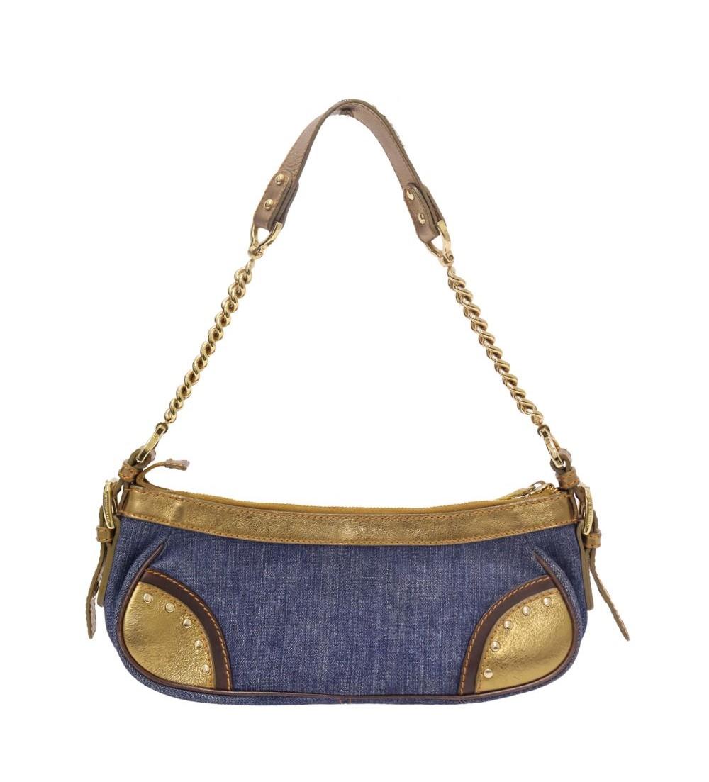 Dolce & Gabbana Vintage Denim Shoulder Bag, Features a gold tone plaque at the front, gold tone accents, chain and leather top handle, and one interior zipper pocket.

Material: Denim and Leather
Hardware: Gold
Height: 11cm
Width: 27cm
Depth: