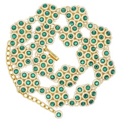 DOLCE & GABBANA Collier vintage à fleurs entrecroisés avec cristaux verts émeraude
