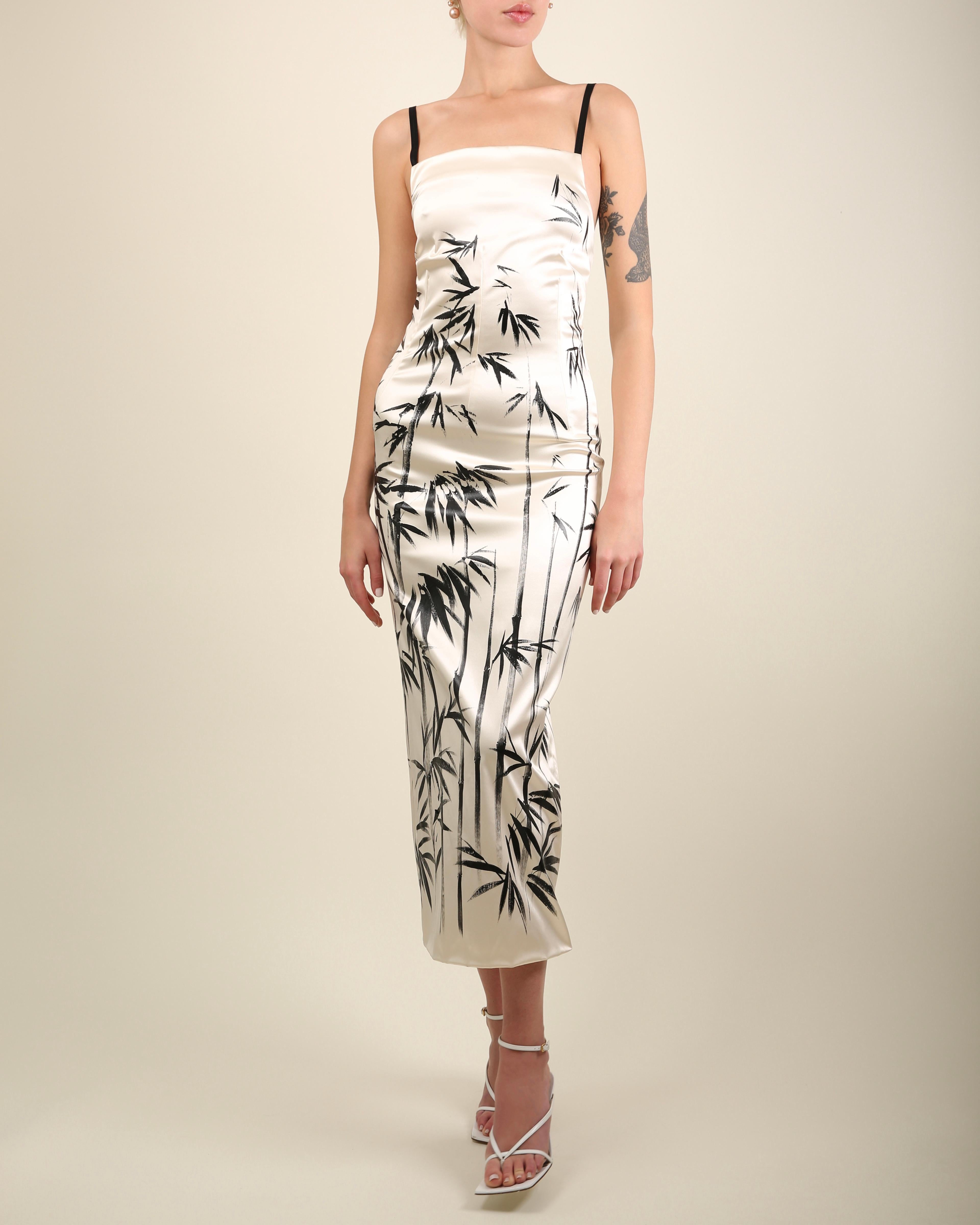 Dolce & Gabbana ivory and black satin midi length dress - possibly full length depending on your height - this can be easily shortened if you would prefer a shorter fit
Black brush stroke abstract print
Black elastic straps
Concealed black zip

FREE