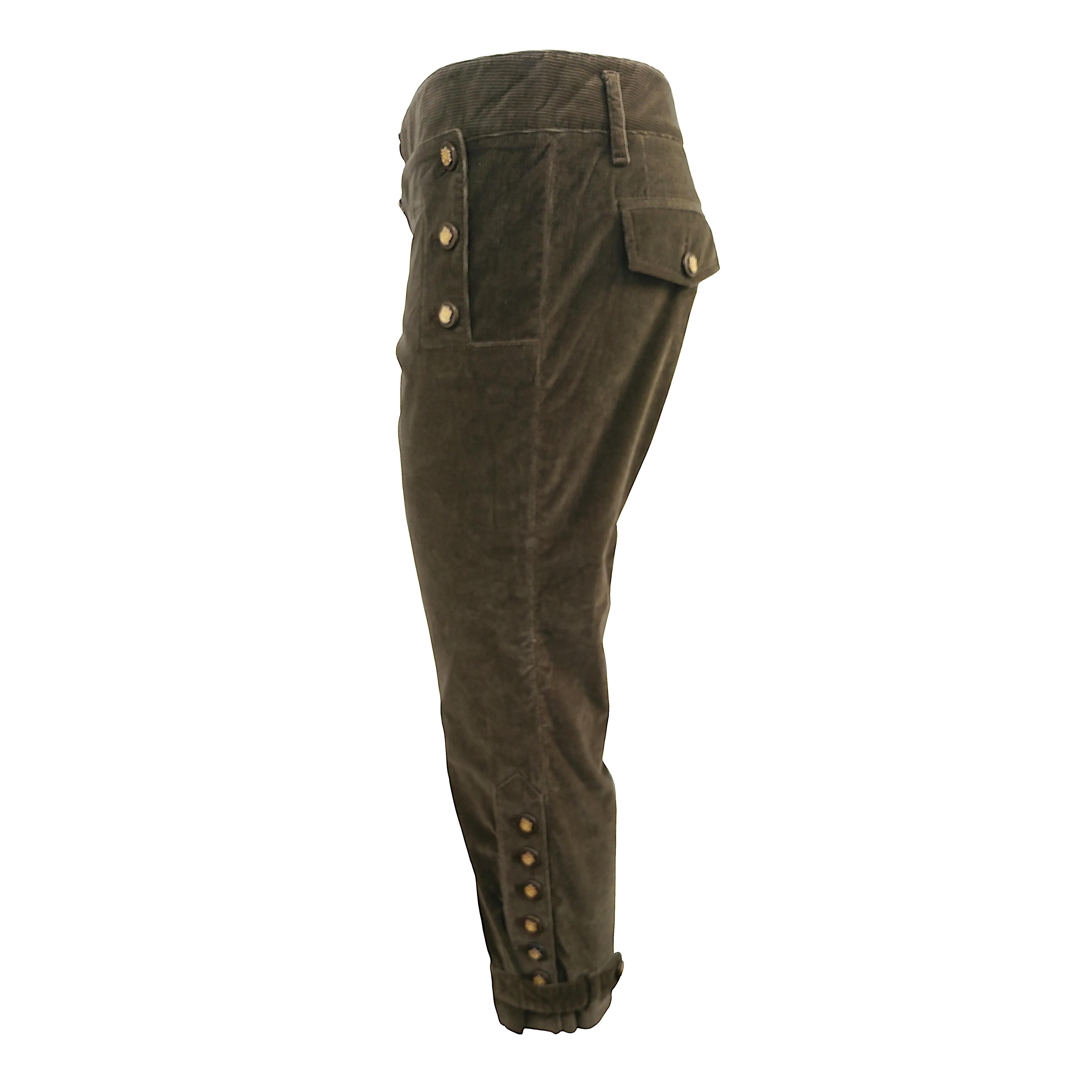 Introducing these Dolce&Gabbana 7/8 length pants, a unique blend of style and comfort. Crafted from olive green stretch cotton corduroy, these pants showcase a distinctive Tyrolean-inspired design. The textured fabric adds a touch of luxury, while