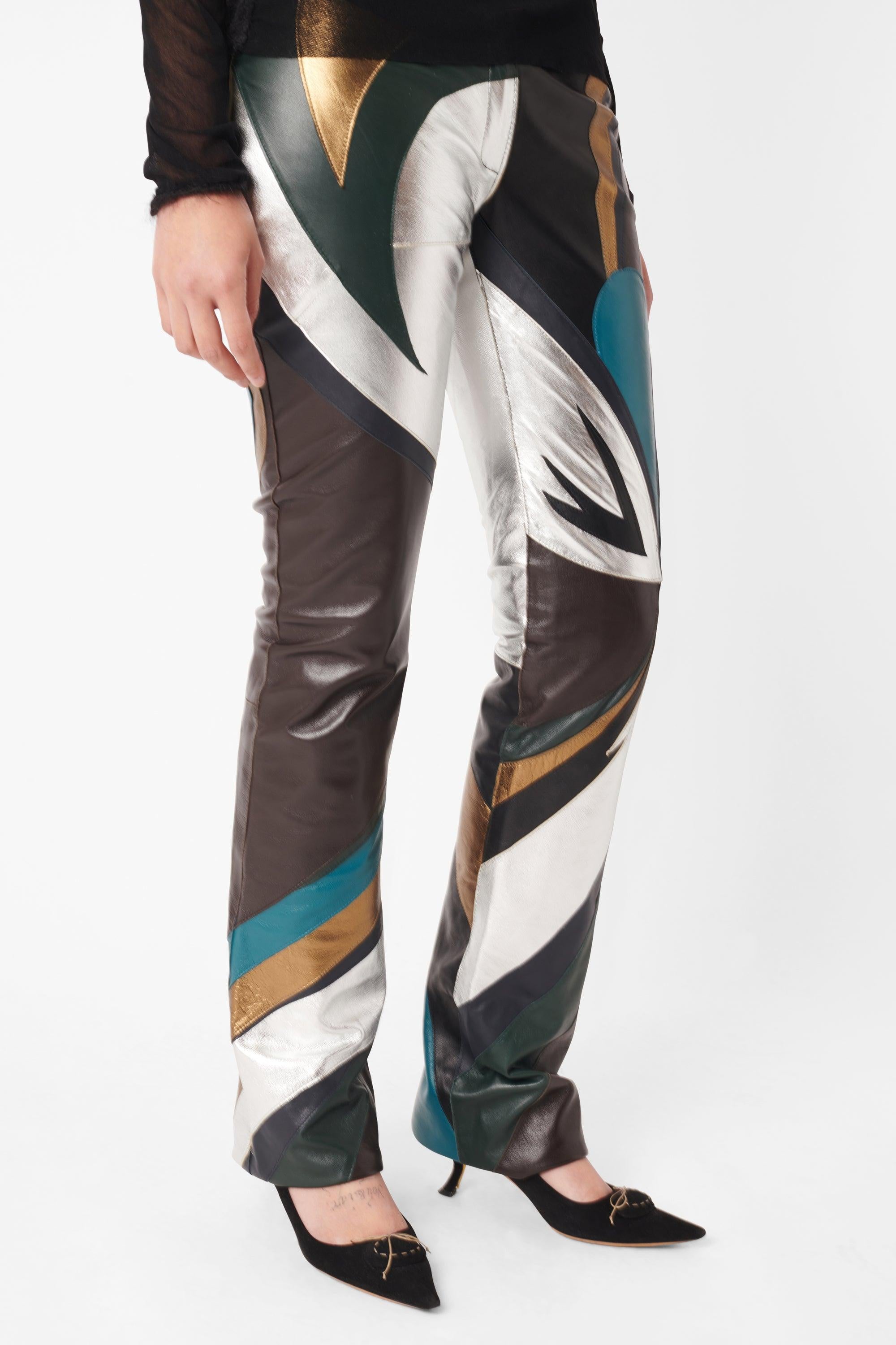 Vintage Dolce & Gabbana Spring Summer 2002 runway leather trousers. Features mid rise cut, straight bootleg fit, multi-coloured leather patchwork detailing and zip front closure. Look 39 on the runway. In excellent vintage condition.

Brand: Dolce &