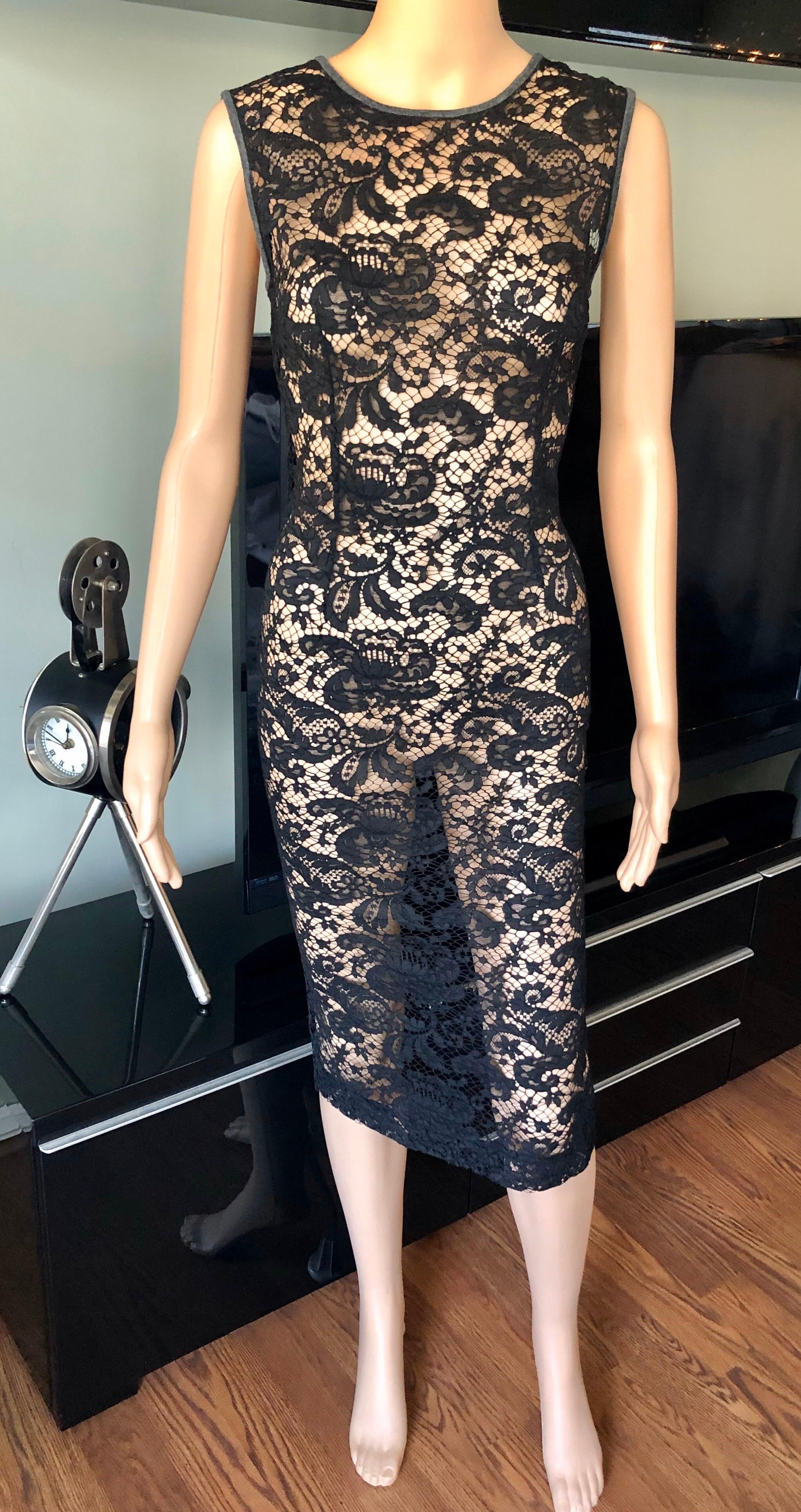 Dolce & Gabbana sheer lace midi dress with crew neck, floral lace throughout and concealed zip closure at back. Please note the size tag has been removed. Please find below the approximate measurements:
Chest: 16-18