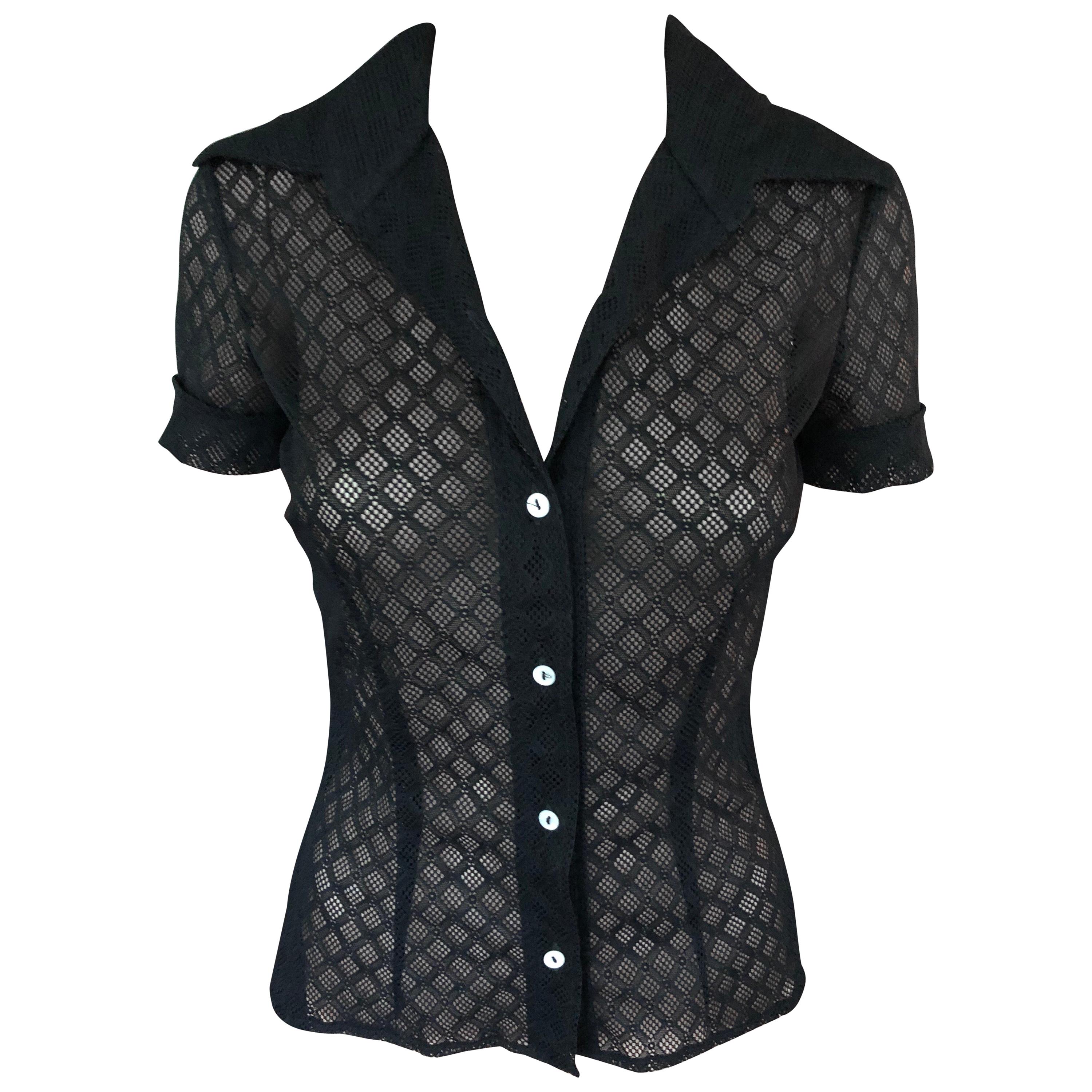 Dolce & Gabbana Vintage Sheer Mesh Lace Eyelet Button-Up Black Top Shirt Size S

Dolce & Gabbana sheer stretchy lace mesh eyelet black top with pointed collar, short sleeves, and exposed button closures at front. Please note the size tag has been
