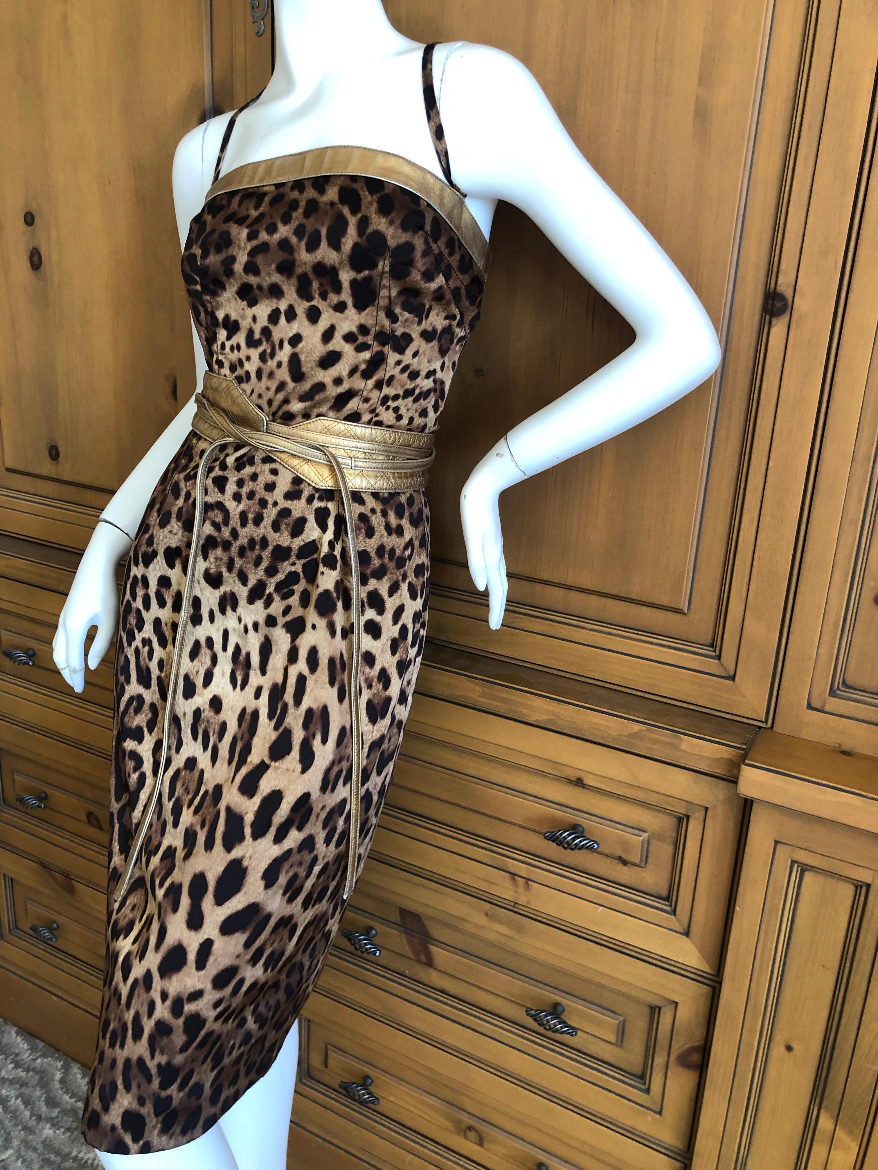 Dolce & Gabbana Vintage Silk Leopard Print Silk Cocktail Dress Gold Leather Trim.
This is so pretty, please use the zoom to see details.
  There is  a lot of stretch in the silk.
Size 42
Bust 36