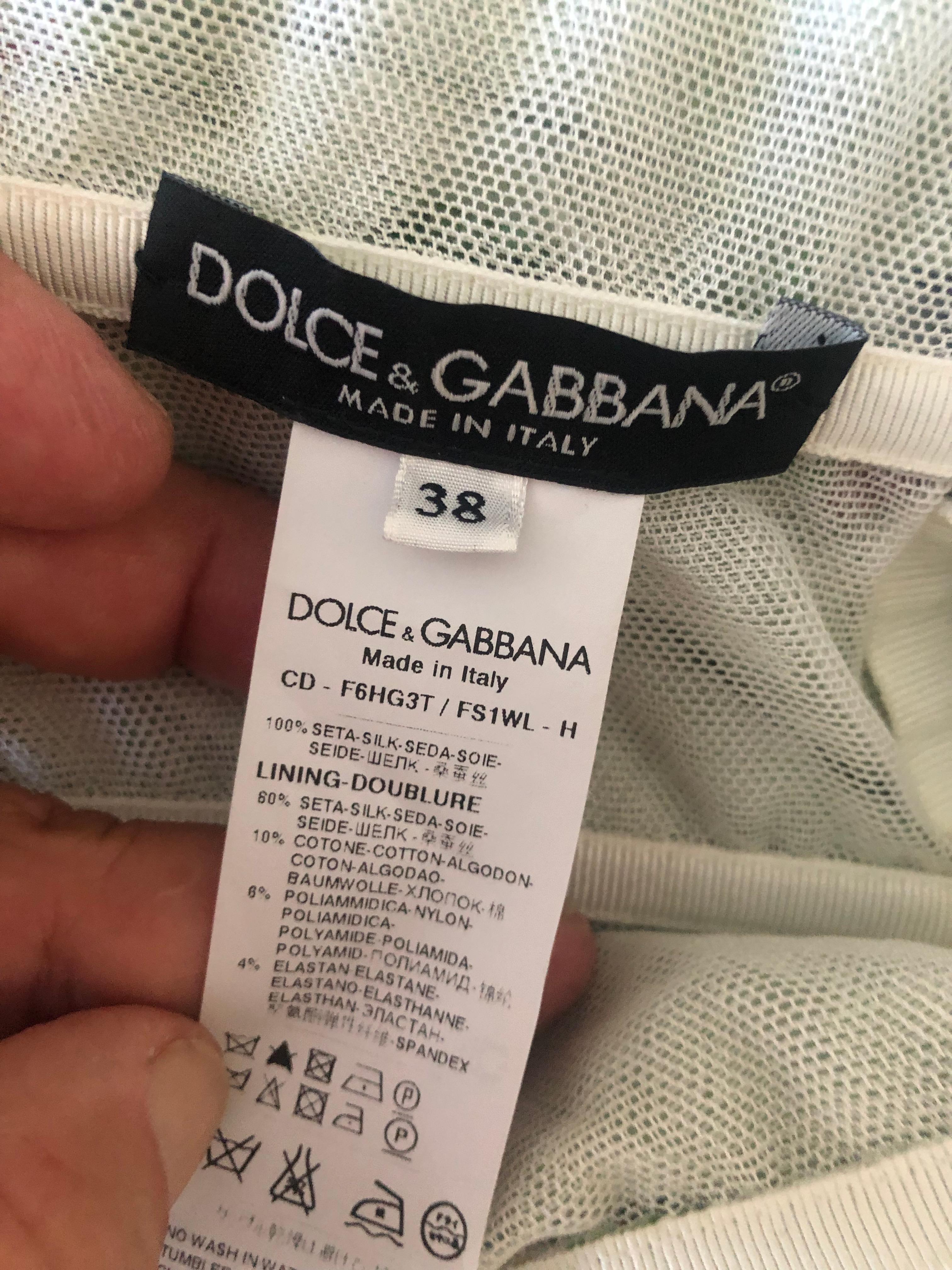 Dolce & Gabbana Vintage Strapless Floral Cocktail Dress with Full Corset and Sash.
 So pretty, there is a full inner corset, and a lot of stretch.
Size 38
 Bust 34
