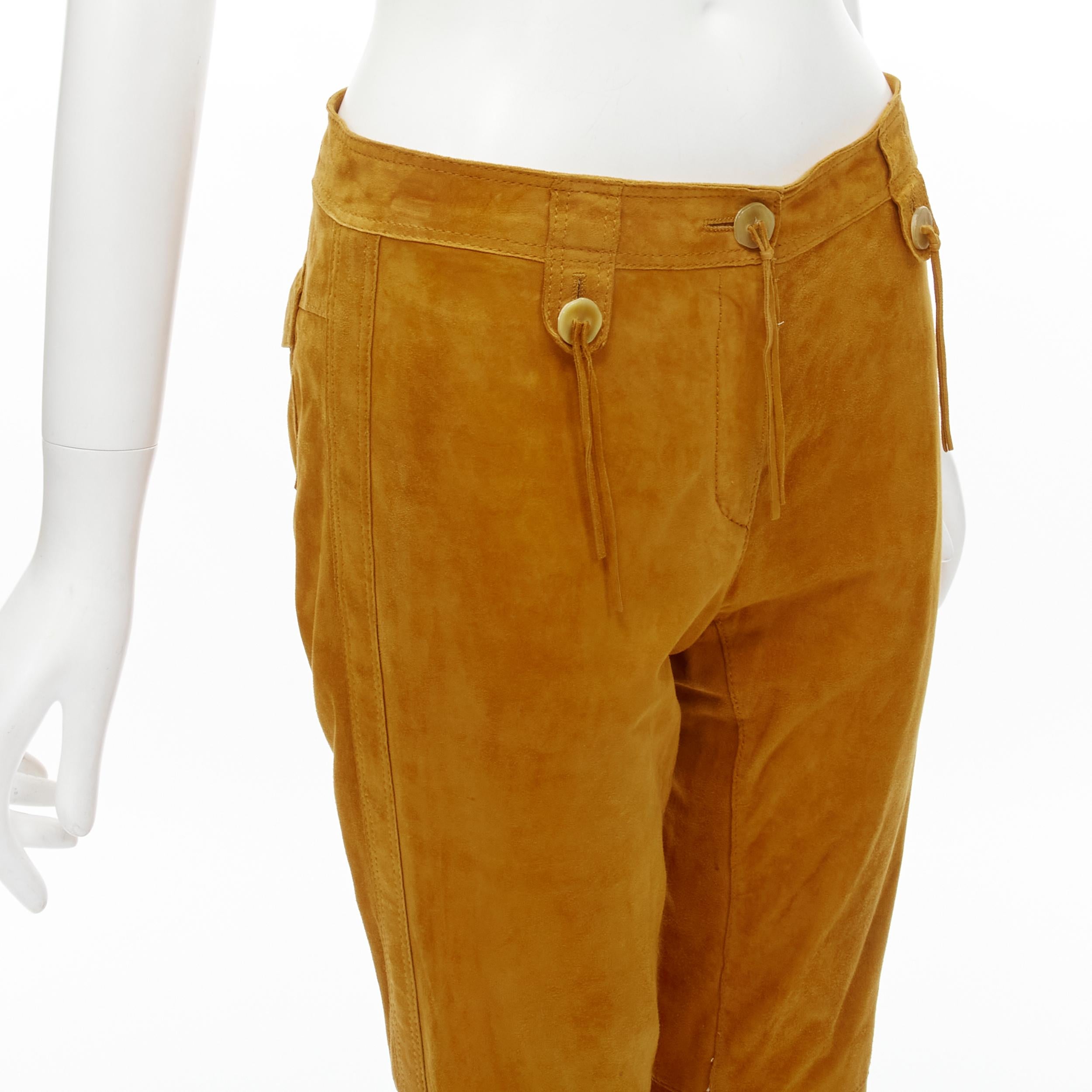 DOLCE GABBANA Vintage tan brown suede leather tassel button pants IT38 XS 
Reference: TGAS/C01252 
Brand: Dolce Gabbana 
Material: Suede 
Color: Brown 
Pattern: Solid 
Closure: Zip Fly 
Extra Detail: Tan brown suede leather upper. Button detailing