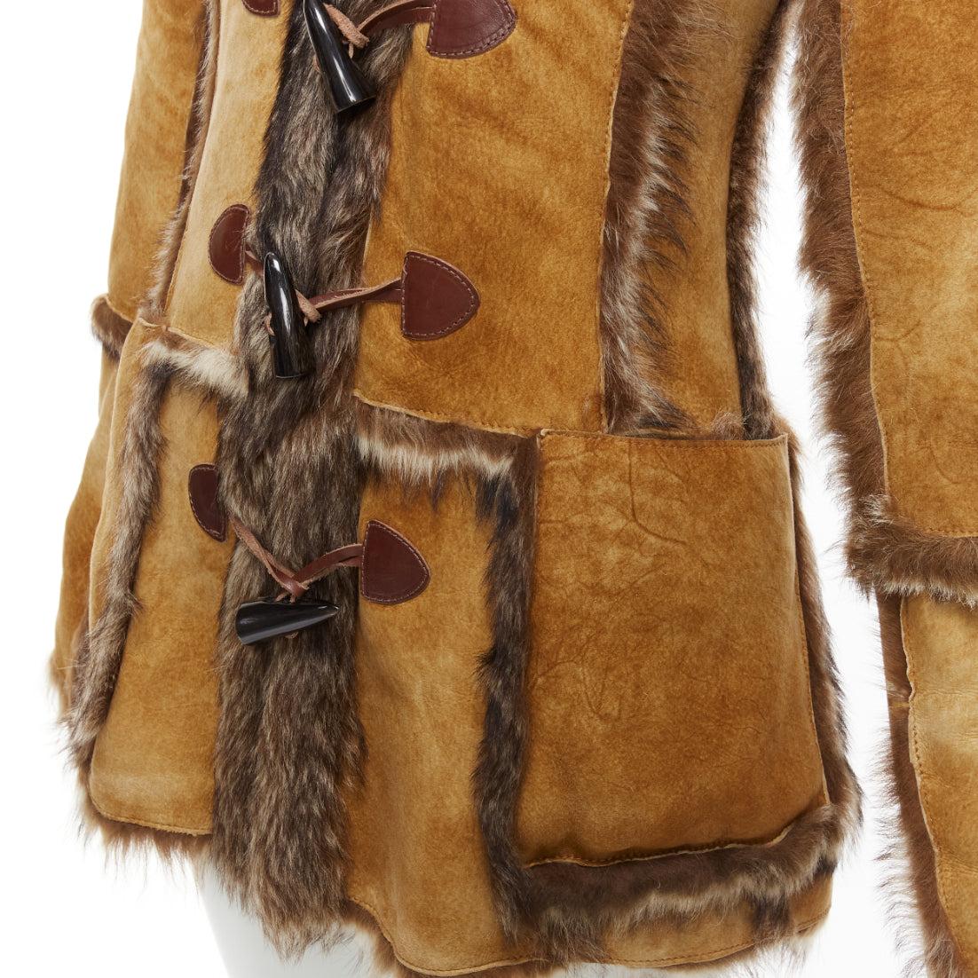 DOLCE GABBANA Vintage tan fur genuine sheepskin fur hooded toggle coat IT38 XS
Reference: NILI/A00011
Brand: Dolce Gabbana
Designer: Domenico Dolce and Stefano Gabbana
Material: Leather, Fur
Color: Brown
Pattern: Solid
Closure: Button
Lining: Brown