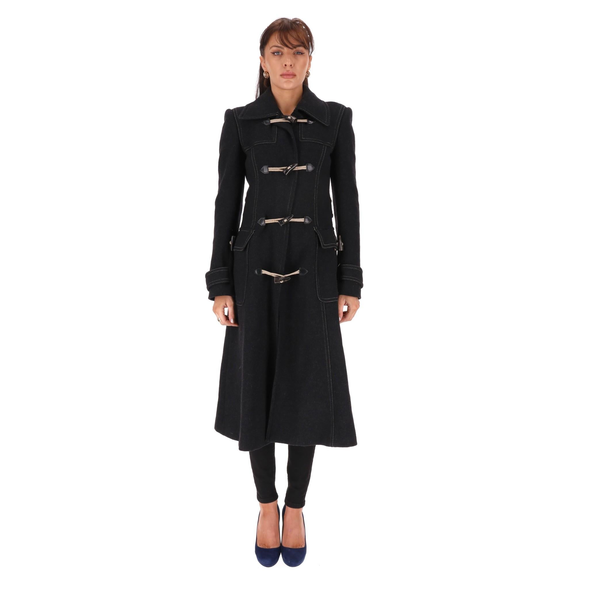 Dolce & Gabbana Virgin Wool Duffle Coat

Black coat crafted from virgin wool blend with horn toggle fastening and belted cuffs

with matching buttons.

Featuring large wing collar, two side flap pockets and belt to the rear.

Rrp Approx.