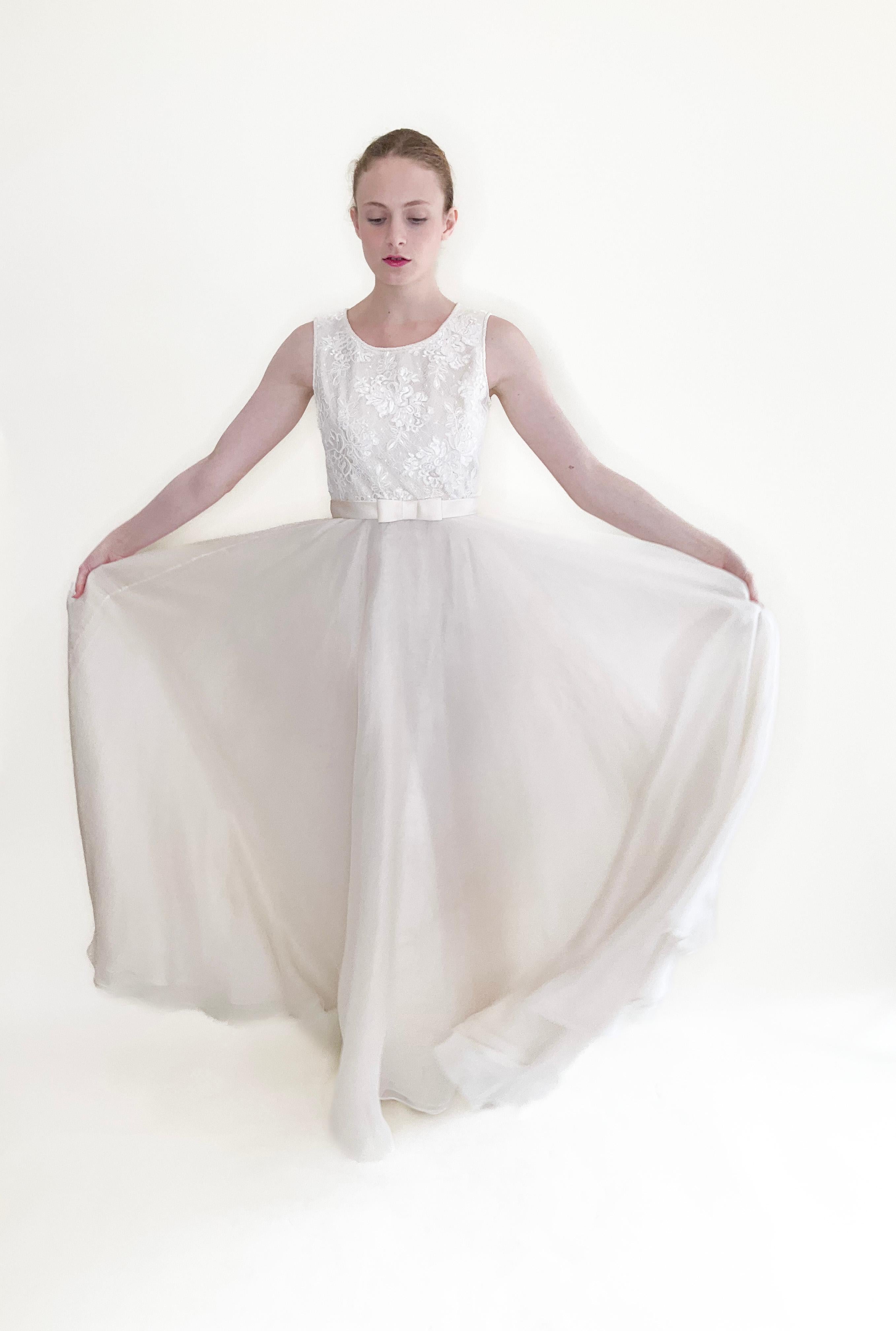 Experience vintage luxury with the Dolce & Gabbana 1990's Lace & Silk Dress. The classic, modest design features a delicate lace bodice and flowy silk fabric, perfect for any special occasion.

Condition: Excellent Vintage Condition

Material: Lace,