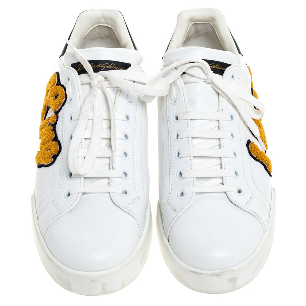 You're sure to feel like a star in these low-top sneakers from the iconic house of Dolce & Gabbana. Made from white leather, the shoes carry round toes, lace-ups, King patch detailing, and the brand name is found on the counters & tongues. They are