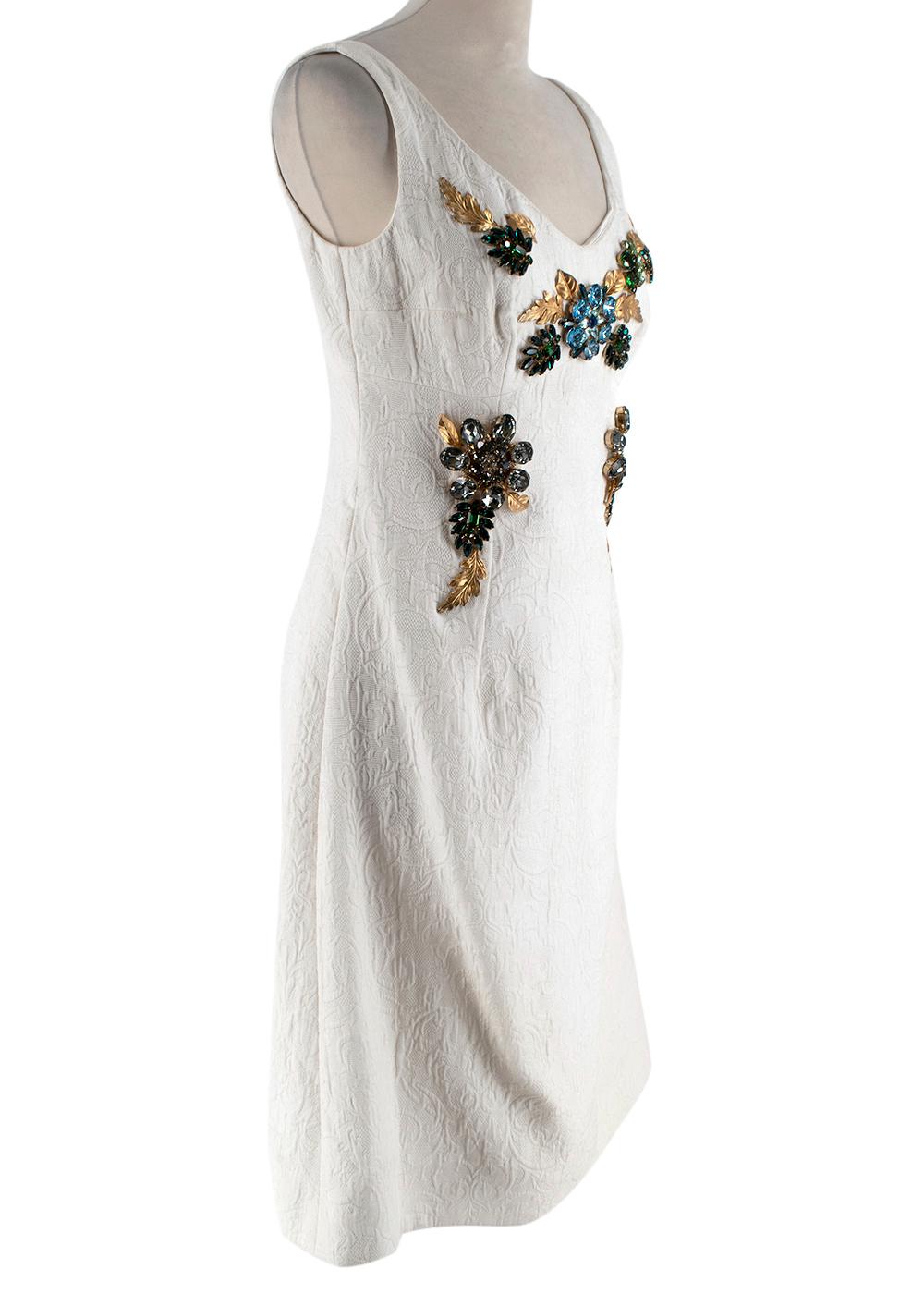 Dolce & Gabbana Cream Textured Jewel Embellished Dress

- Fabric textured with raised pattern
- Gold metal leaves and blue and green jewels embroidered to front 
- V neck
- A-line skirt
- Zip fastening down centre back
- Fully