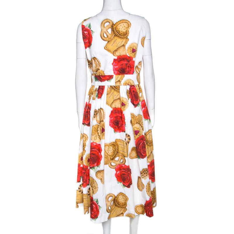 With an interesting cookie and floral print and a darling fit-and-flare silhouette, the dress from Dolce & Gabbana makes for an exuberant yet elegant statement for casual outings. Crafted from cotton for ultimate comfort, the outfit is styled with a